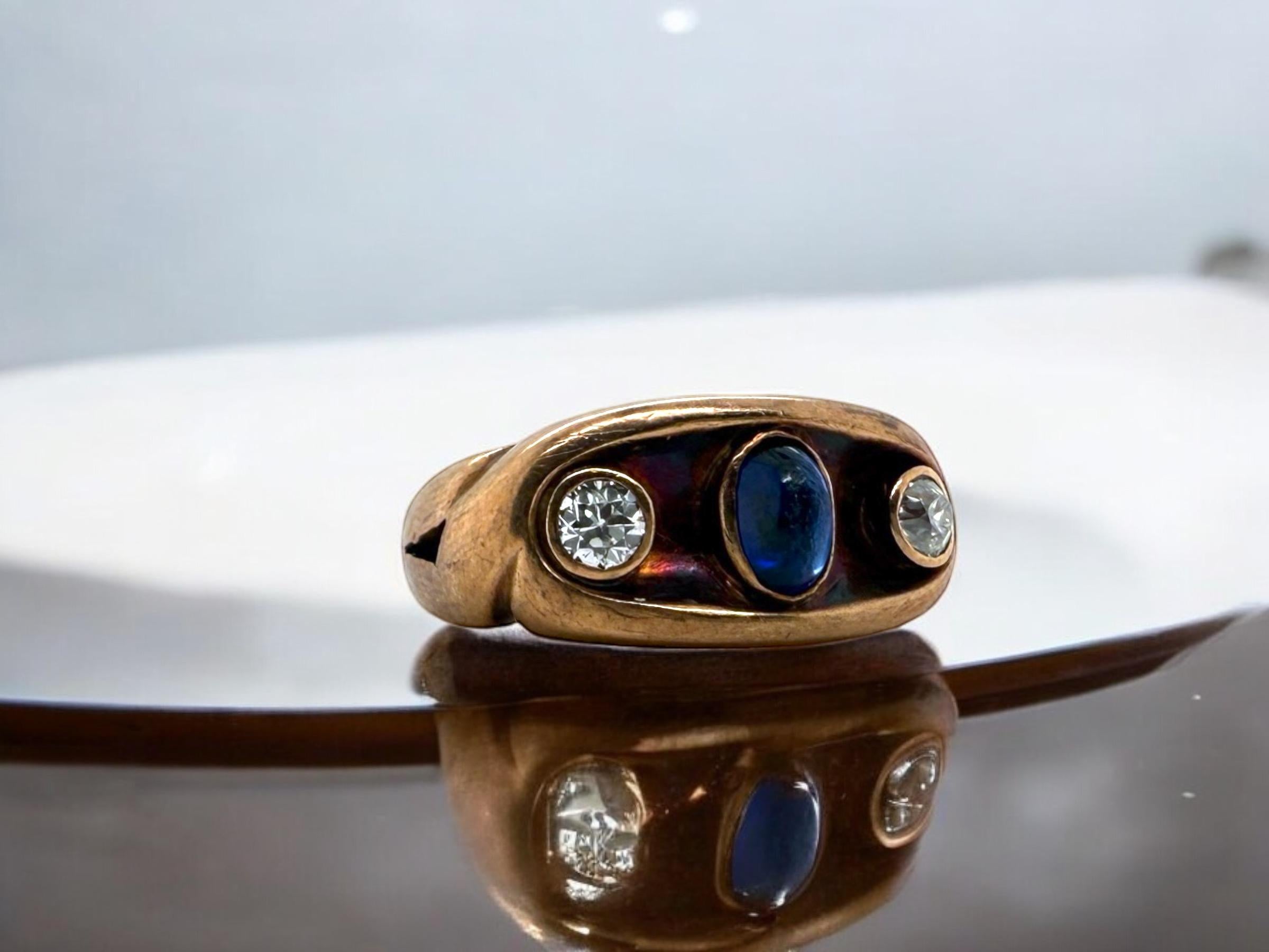 We are loving the crazy patina on this beautiful vintage sapphire & diamond ring!!
The center Gemstone is a lovely cabochon cut blue sapphire & is accented by matching old european cut diamonds.

Ring Details
Material: 14K Rose Gold
Era: Victorian