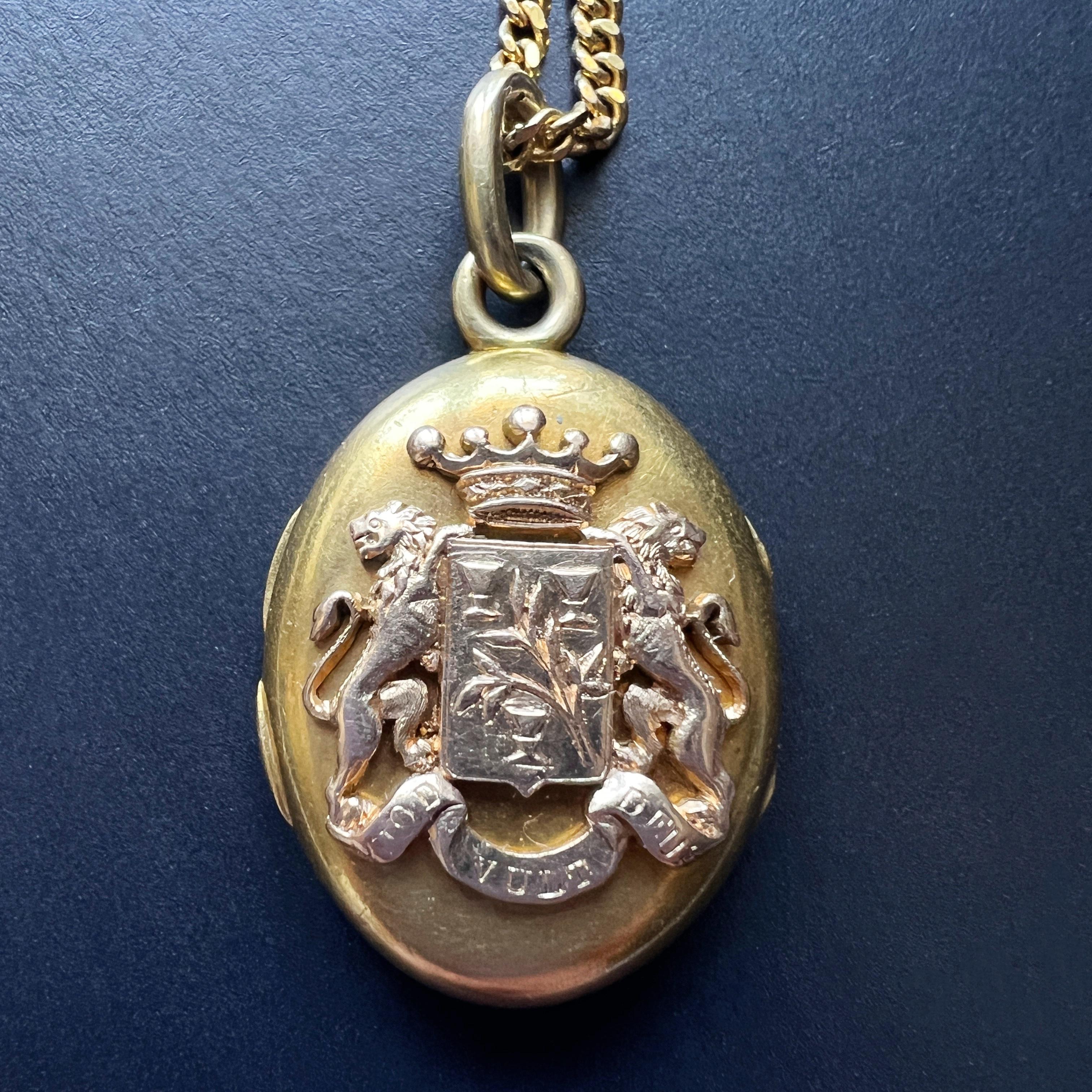 Step back in time with this rare 19th-century locket pendant, a timeless treasure steeped in history and heraldry. Adorned with a beautiful coat of arms featuring two noble lions, a regal crown, delicate flowers and three triumphs, this exquisite