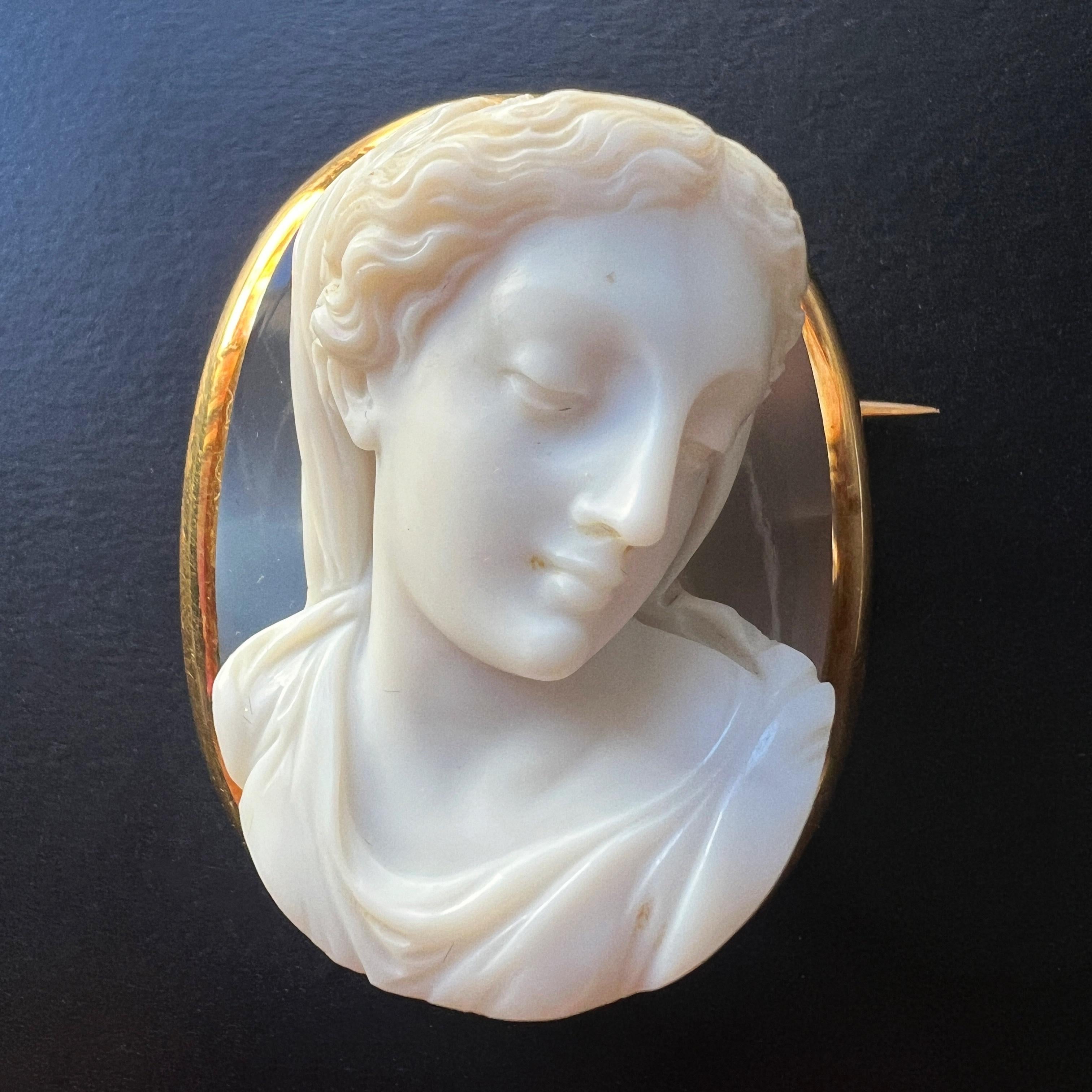 For sale an exceptional 19th century, French work, banded agate cameo brooch. Crafted with unparalleled skill and precision, this exquisite piece is a true testament to the artistry of its time.

At the heart of this brooch lies a mesmerizing