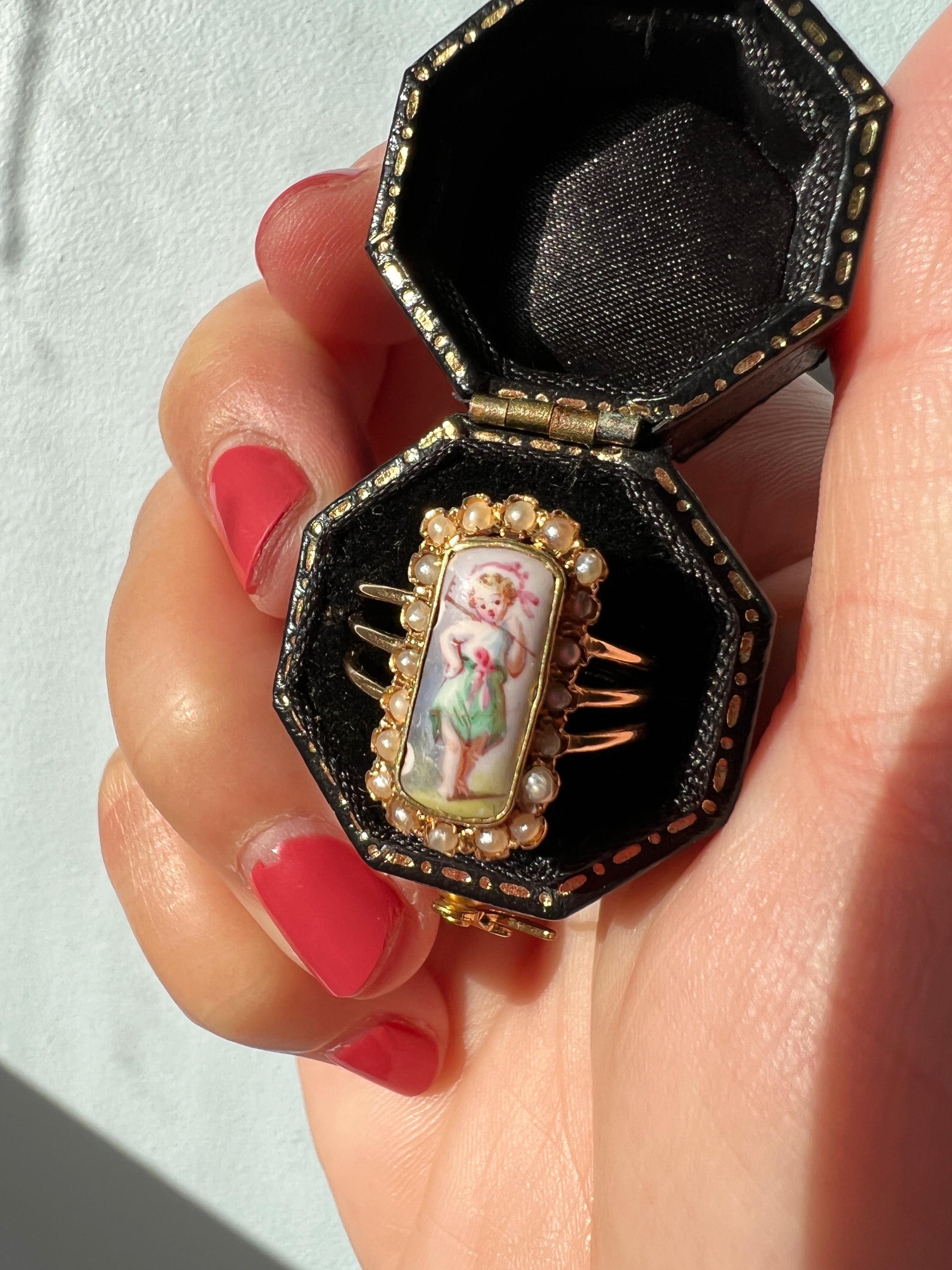 For sale a sweet Victorian era 18k gold enameled ring, featuring a hand painted portrait of a young girl. The colors of the miniature remain vivid after hundreds of years and the little girl looks very joyful. We love the details on the painting