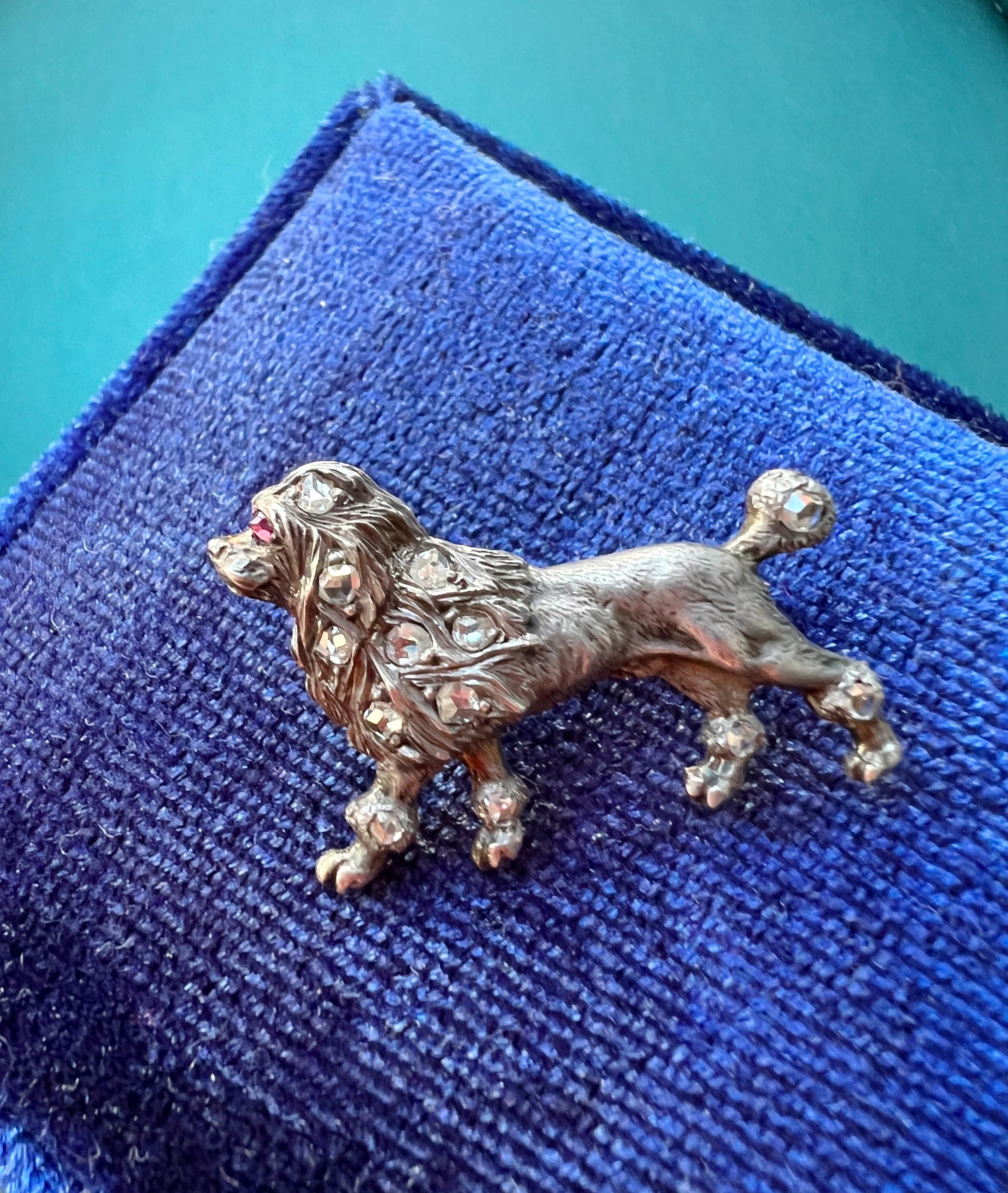Perfectly capturing the expression, personality and physical characteristics of this adored poodle, the maker of this wonderful piece of jewelry pays attention to the smallest details to create a life-like miniature version of this dog on a