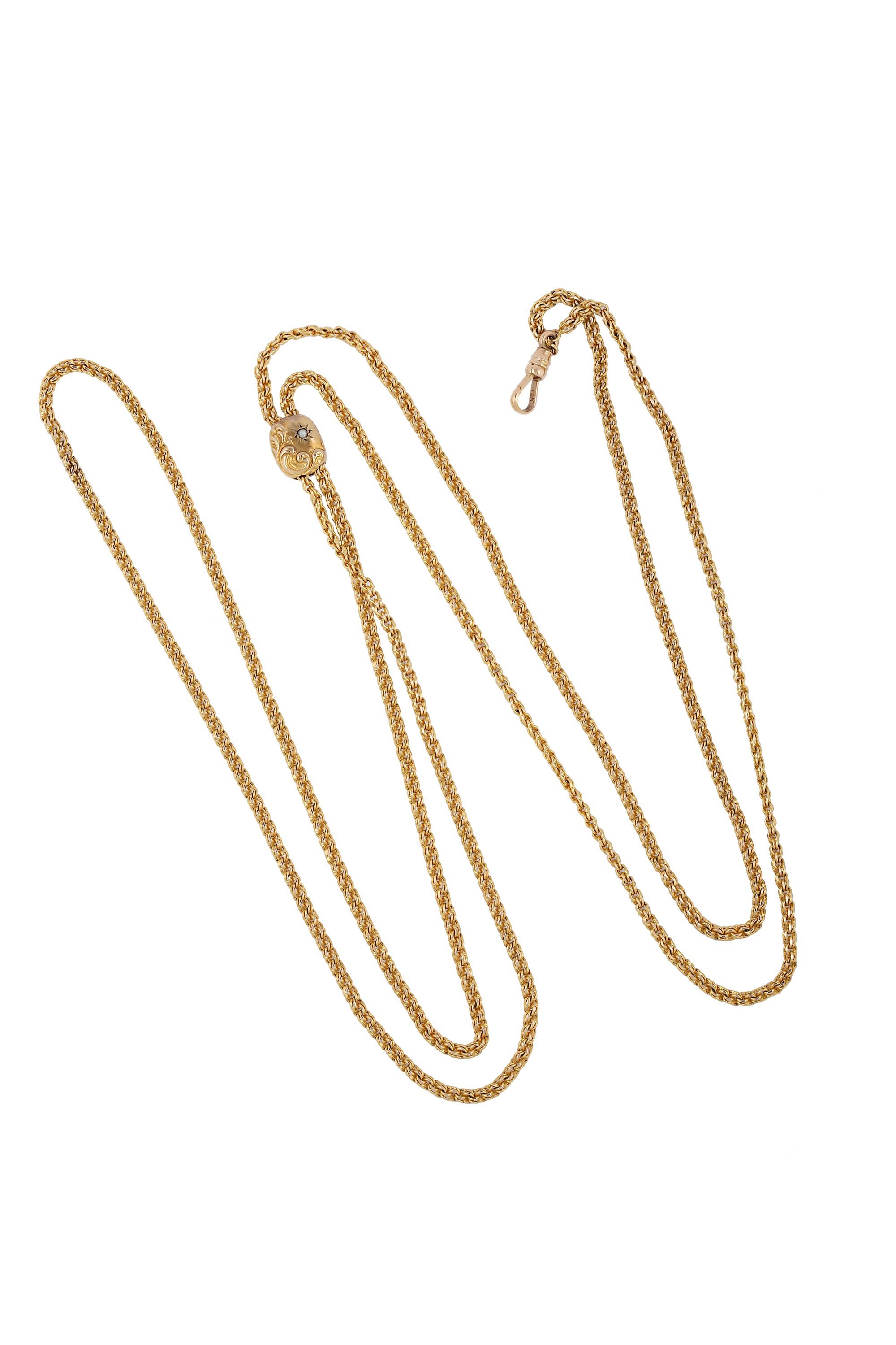 This fine 19th Century antique 14K yellow gold necklace includes a 50-inch chain of double rolo links with a slide which can be located along the chain to create any length 'drop' you feel comfortable with. 
The slide is 12mm tall and moves smoothly