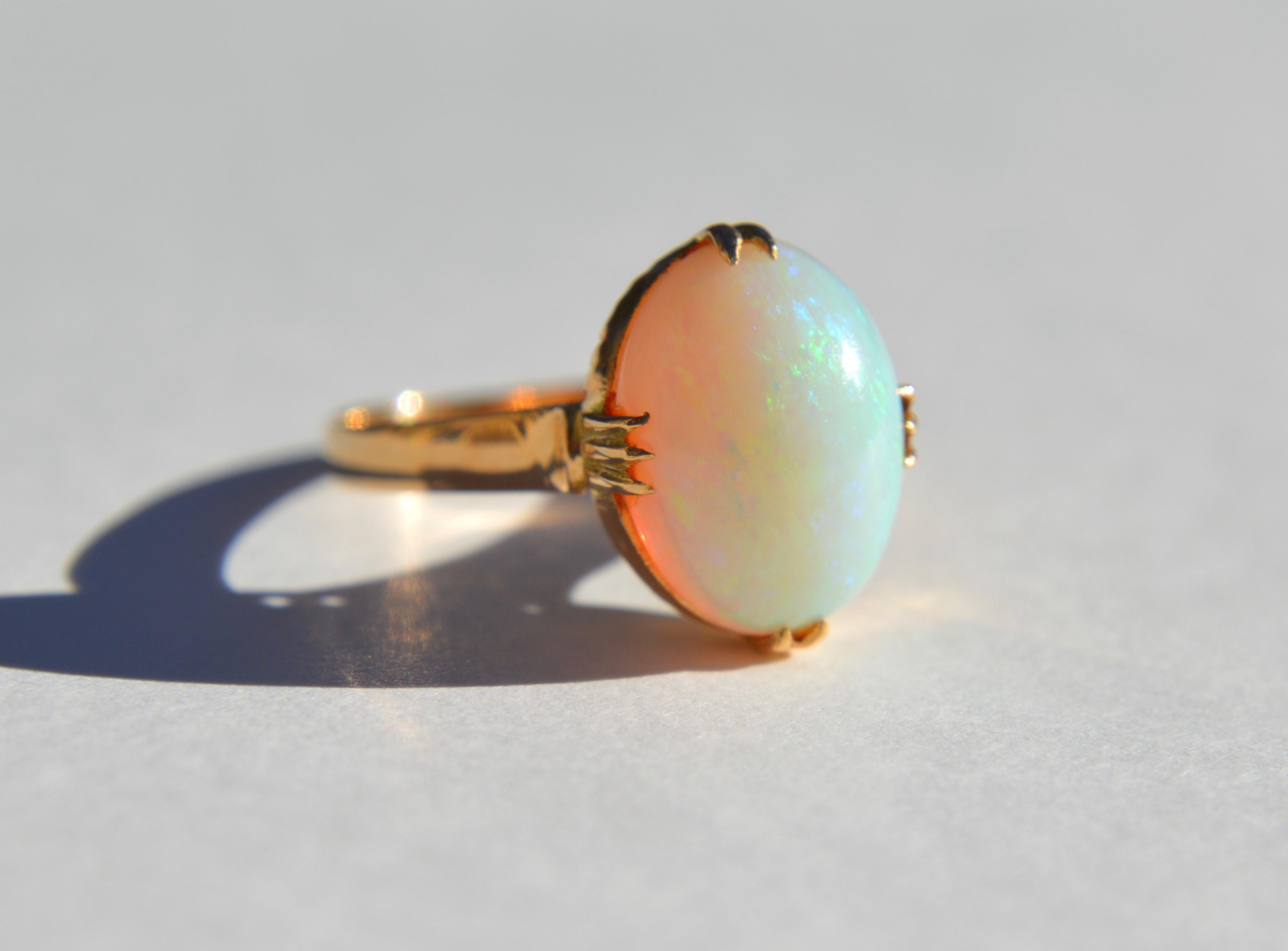 Exceptionally beautiful Victorian era antique circa late 1800s 4 carat fiery rainbow flecked Australian opal cabochon set in solid 18K rose gold. In very good condition, no scratches or wear to the opal. Ring has been polished and cleaned. Marked as