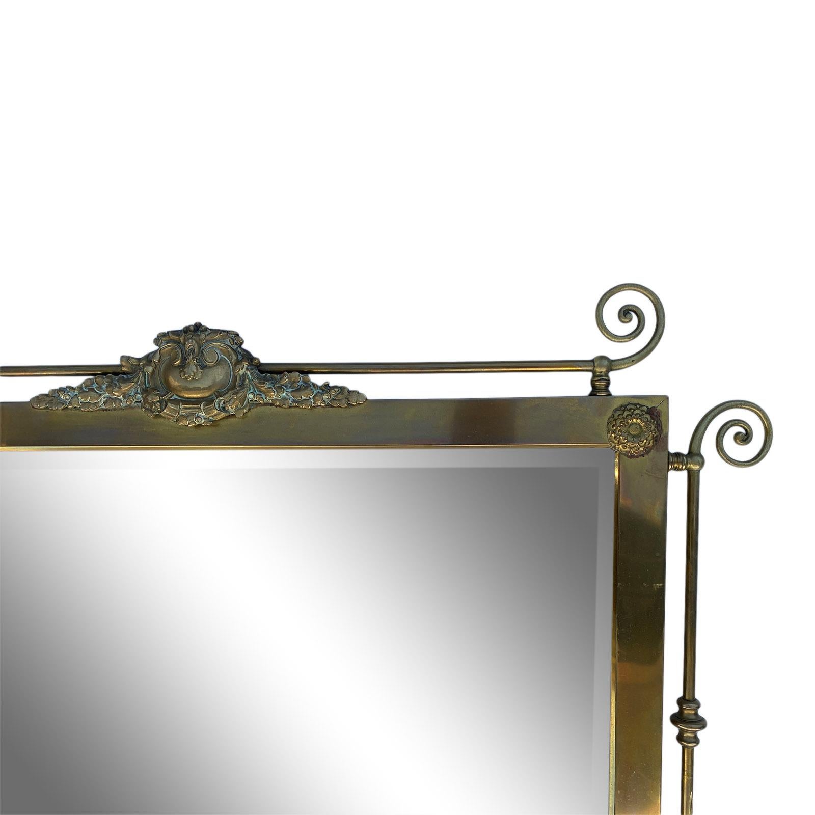 Victorian era brass wall mirror in beautiful patina.