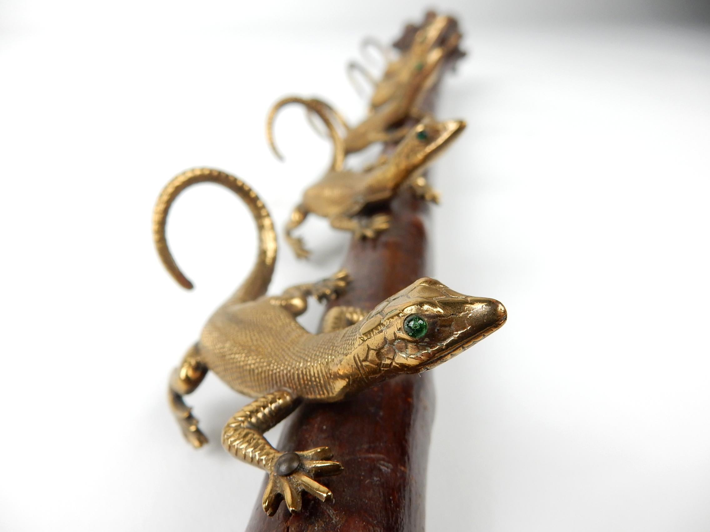 Functional decorative art piece from the Victorian era. 
We believe it was indented to be a tobacco pipe holder
however keys or the like would work just as well.
Lizards have life-like detail with emerald green glass eyes.
Natural cherry burl