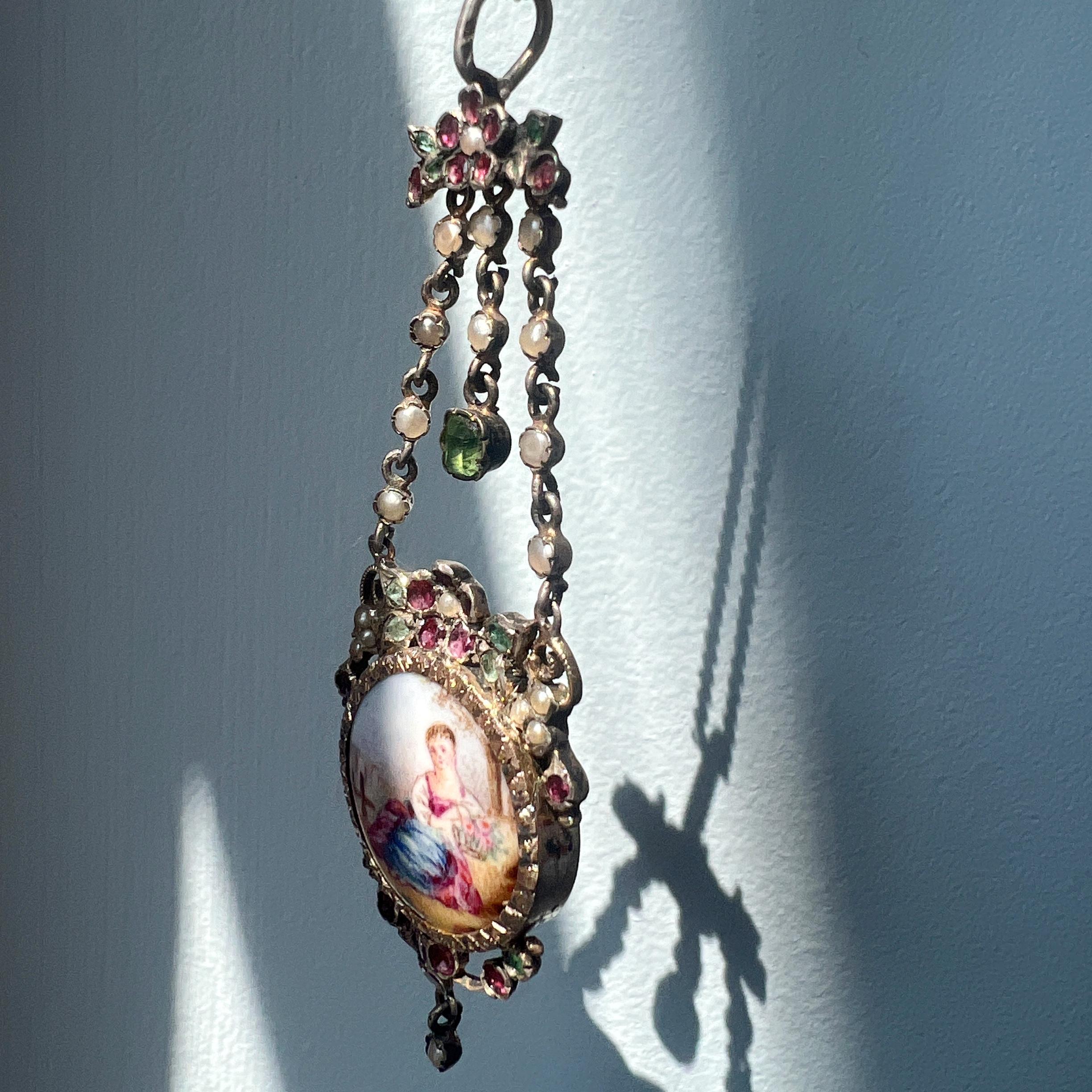 Cabochon Victorian era enamel miniature portrait pendant with emeralds and garnets For Sale