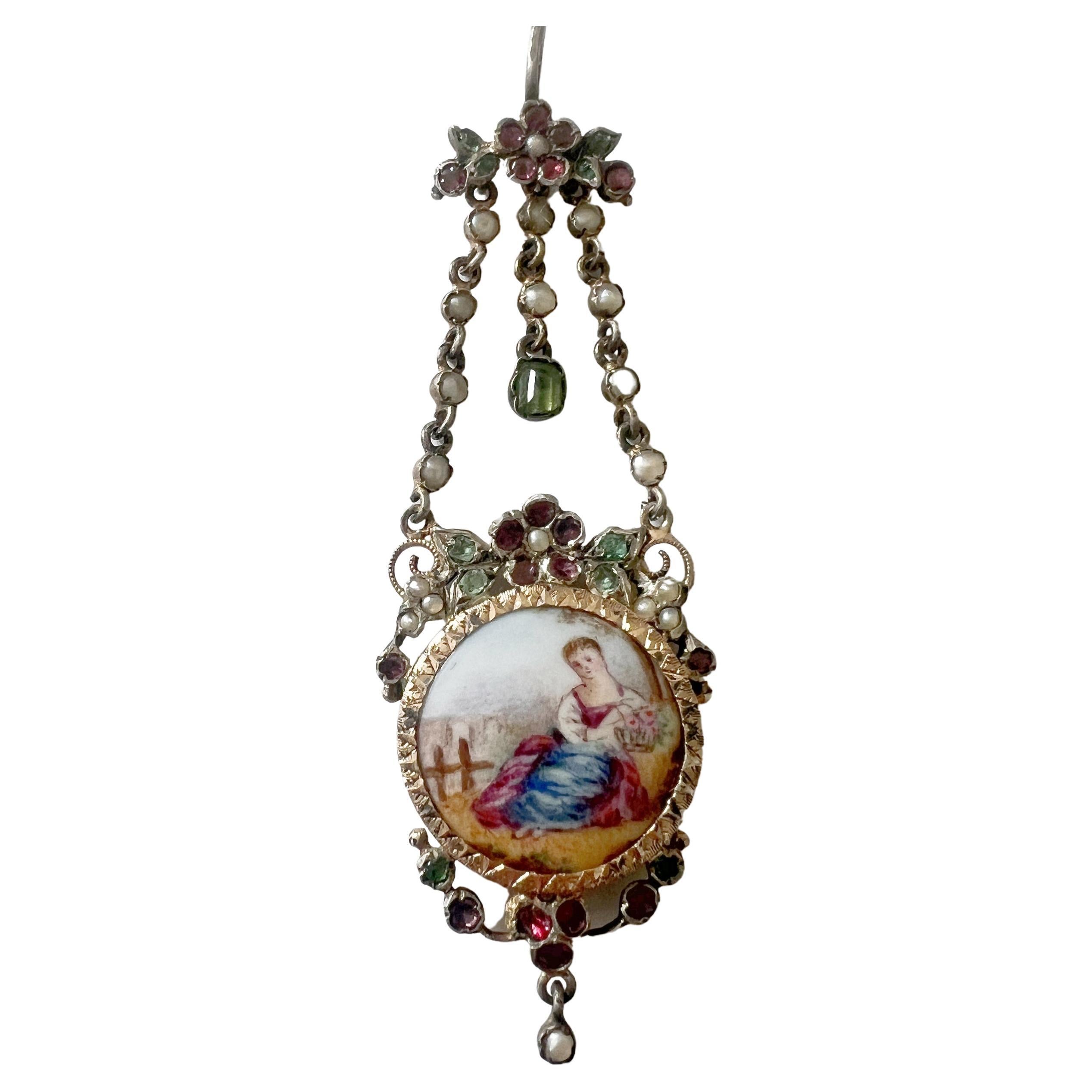 Victorian era enamel miniature portrait pendant with emeralds and garnets For Sale