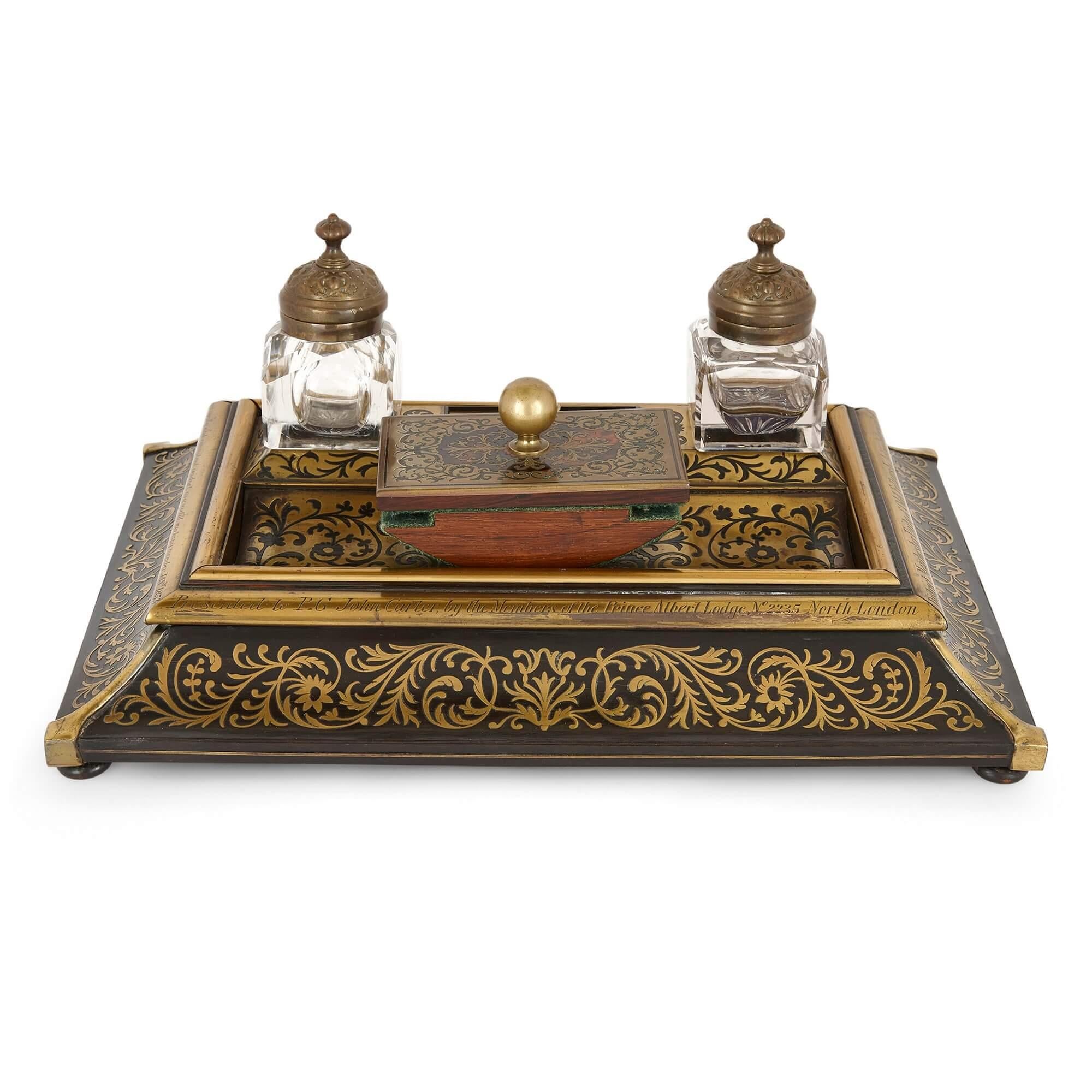 Victorian era inkstand with Boulle marquetry in ebonised wood and brass
English, dated 1853
Measures: Height 17cm, width 38.5cm, depth 27.5cm

This 19th Century English inkstand directly references the Golden Age of French design, incorporating