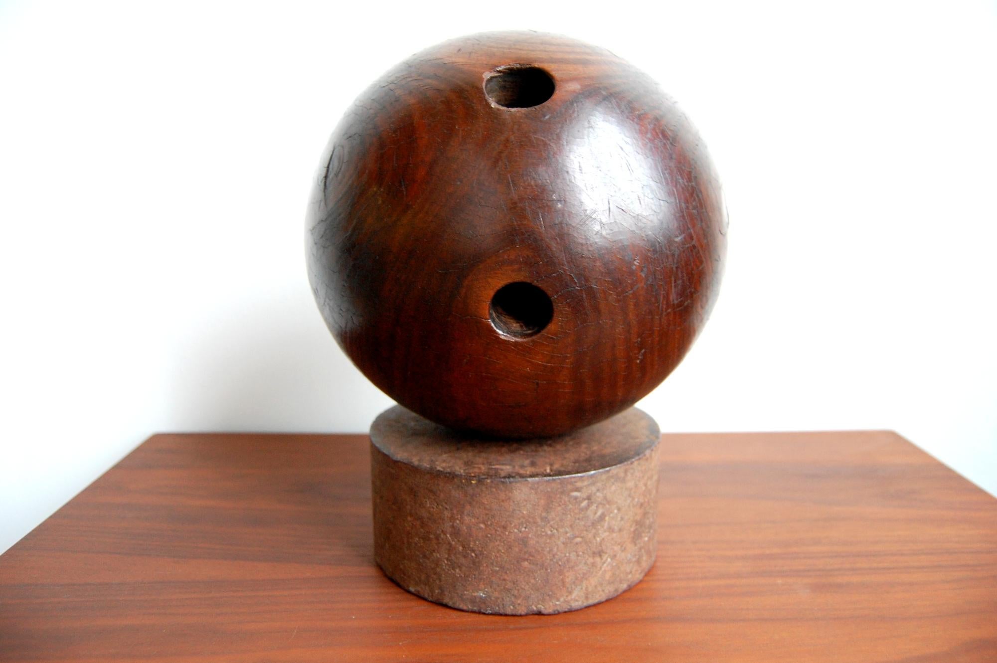 Victorian era Lignum Vitae bowling ball on steel stand. Ball has beautiful patina and figuring. Ball itself measures 8 1/2