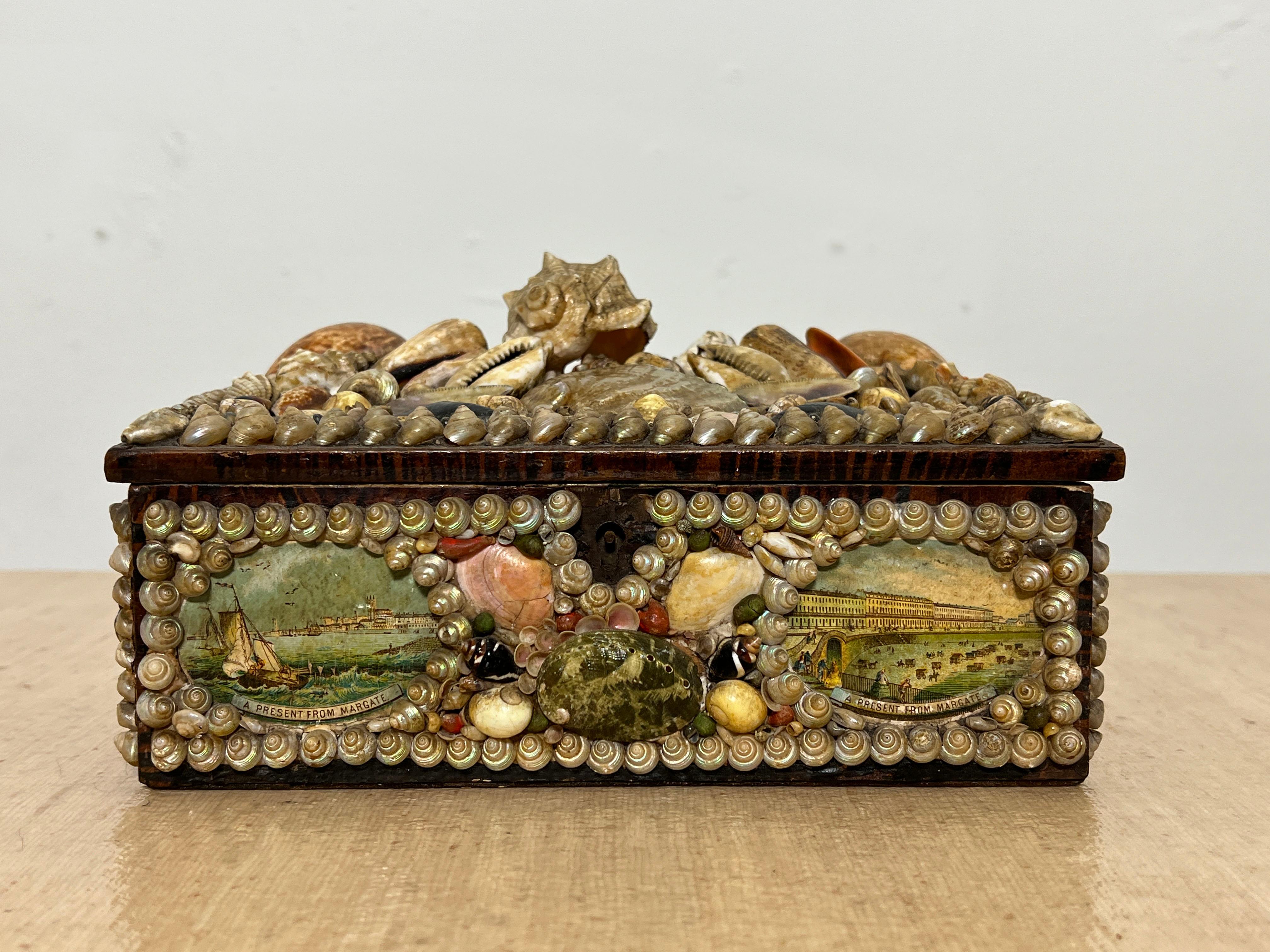 Victorian era seashell decorated souvenir box from the famed Margate Grotto in England.  Two panoramic panels depict the Margate resort.