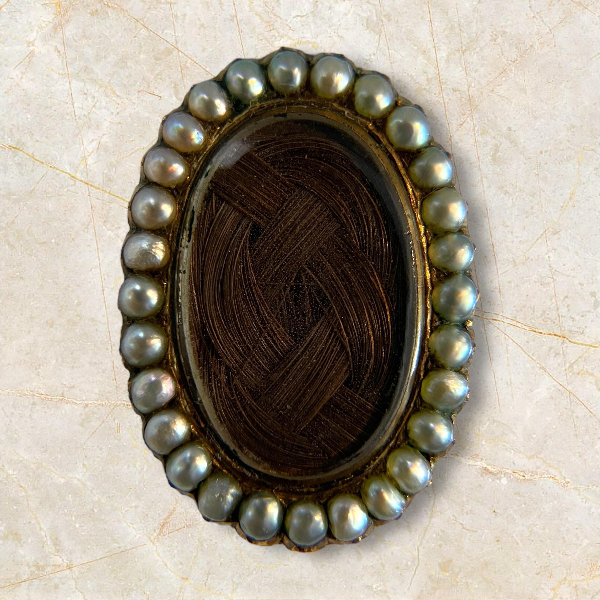 Step into the past with this exquisite antique Victorian mourning brooch, crafted in 14k yellow gold and adorned with natural pearls. This brooch is a poignant reminder of the Victorian era's sentimental jewelry, featuring a unique design that