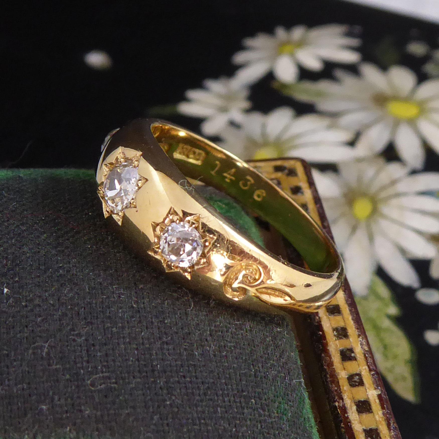 A classic Victorian diamond ring set with three sparkling old diamonds in a gyspy star settings.  The ring has been decorated with a small scroll pattern to each shoulder which adds to the quality finish of the ring.  The band is quite substantial