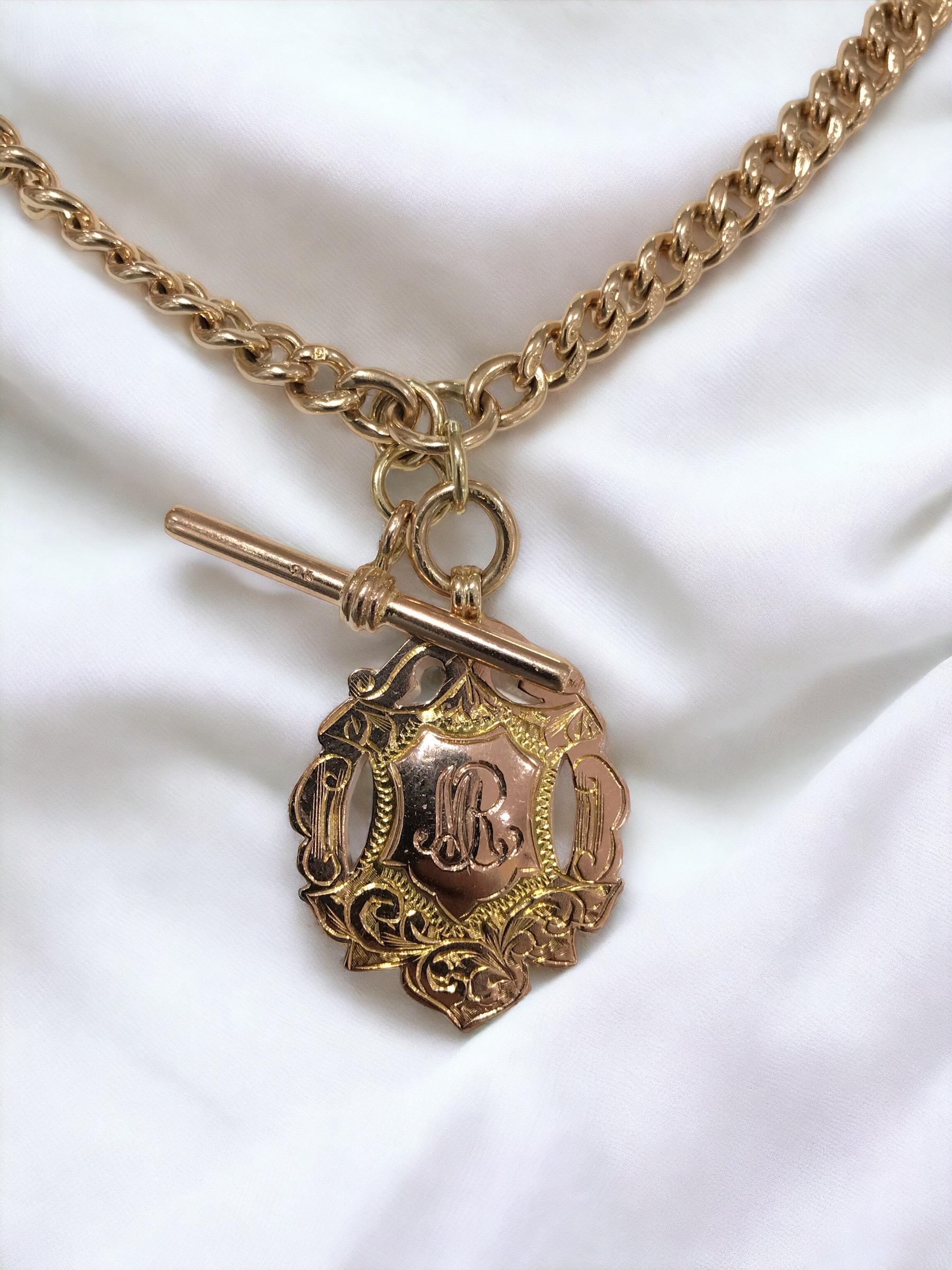 We absolutely love this vintage beauty!
She was likely used as a chain for a pocket watch & later converted to be used as a beautiful necklace.
The charm is a lovely shield shape & is engraved, MR, and has green gold accents around the shield.
Each