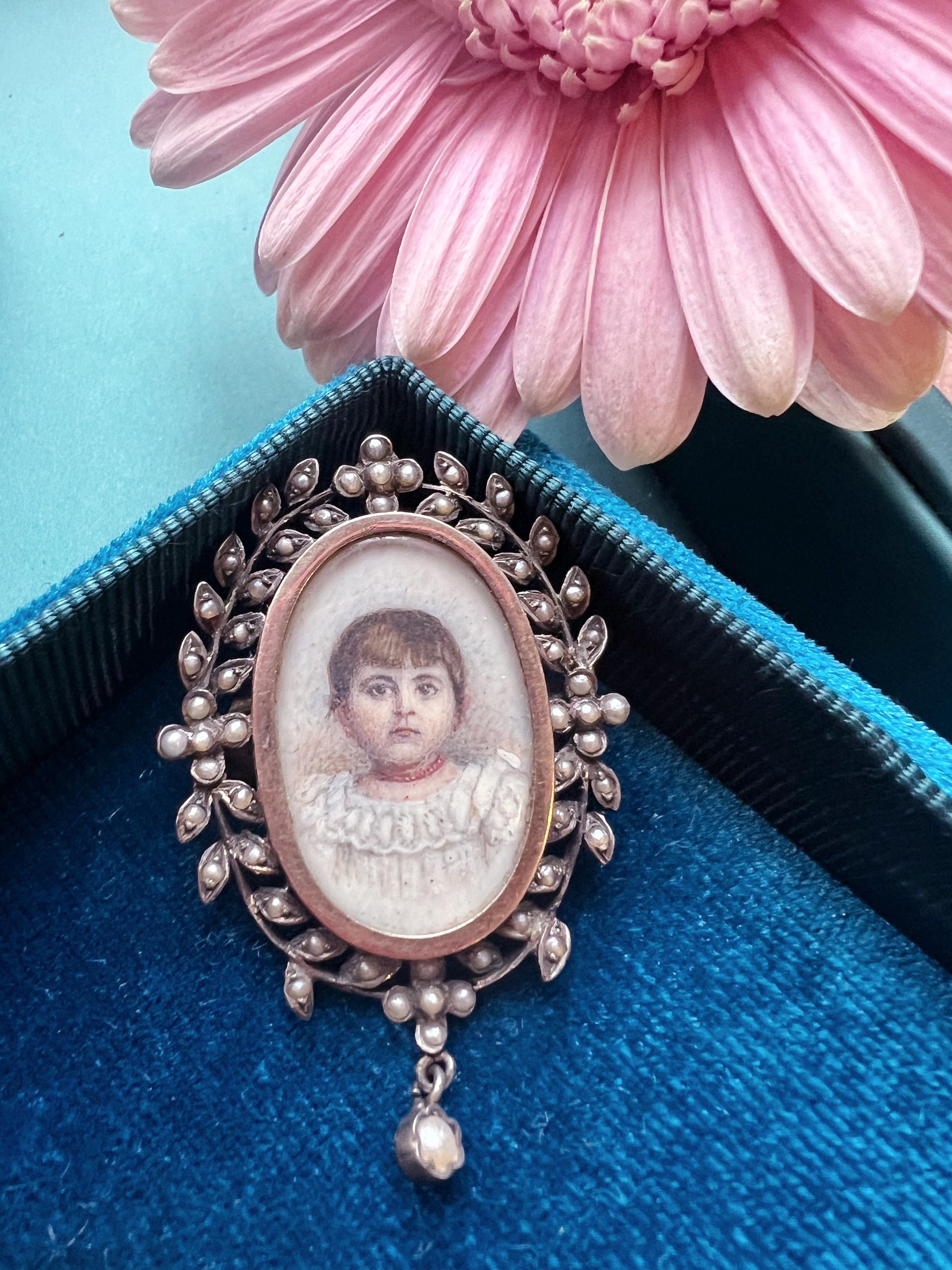 For sale a very sweet, Victorian era miniature portrait brooch.

The brooch features a young girl painted with a strand of red coral beads necklace. The painter paid great attention to draw the girl's white dress on which the beautiful red coral