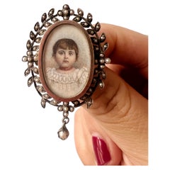 Used Victorian era young girl with coral necklace miniature portrait brooch