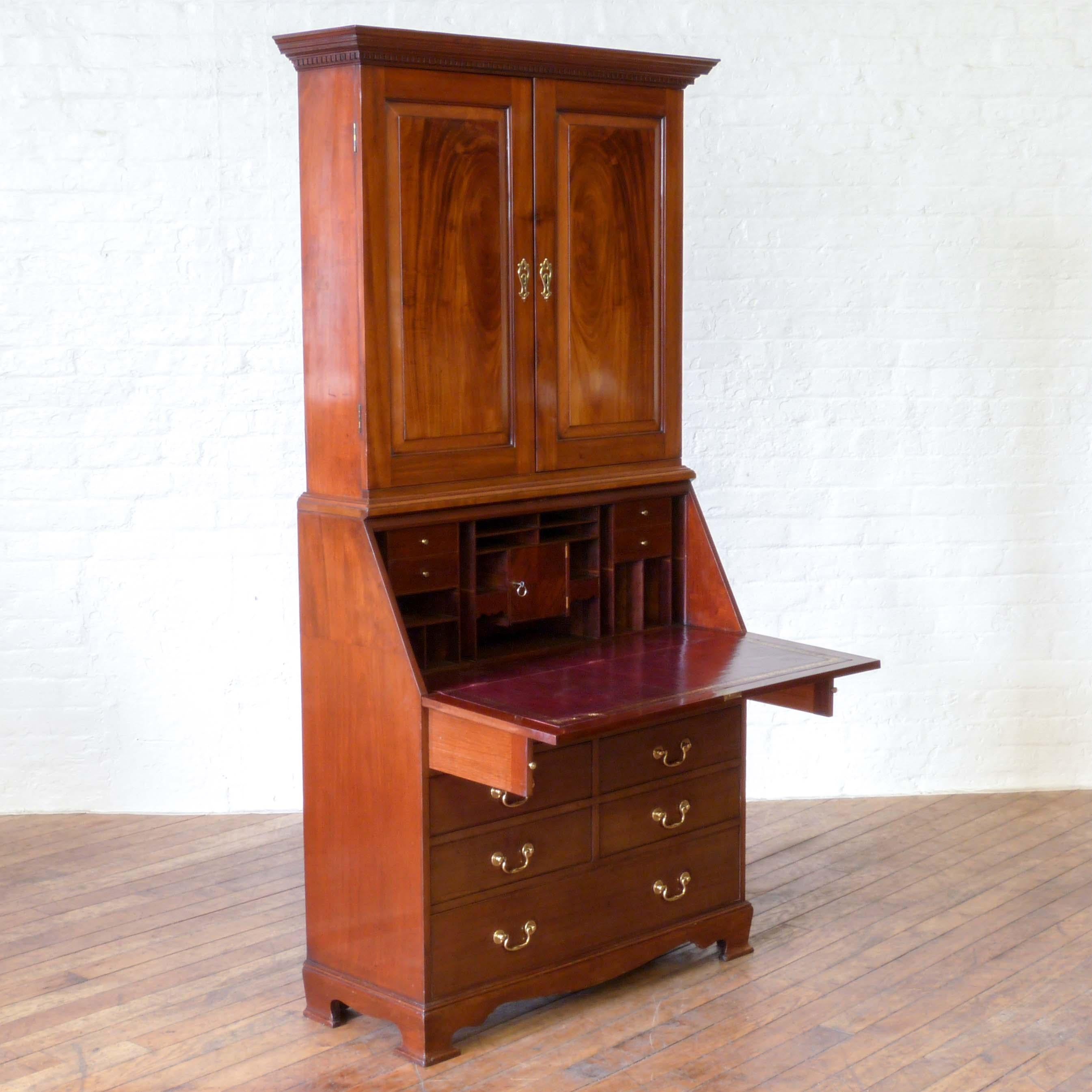 A stunning Victorian estate bureau bookcase of very shallow proportions. We feel that this piece was put together by a country estate cabinet maker in the late Victorian period. Using beautiful cuts of mahogany and oak linings from earlier