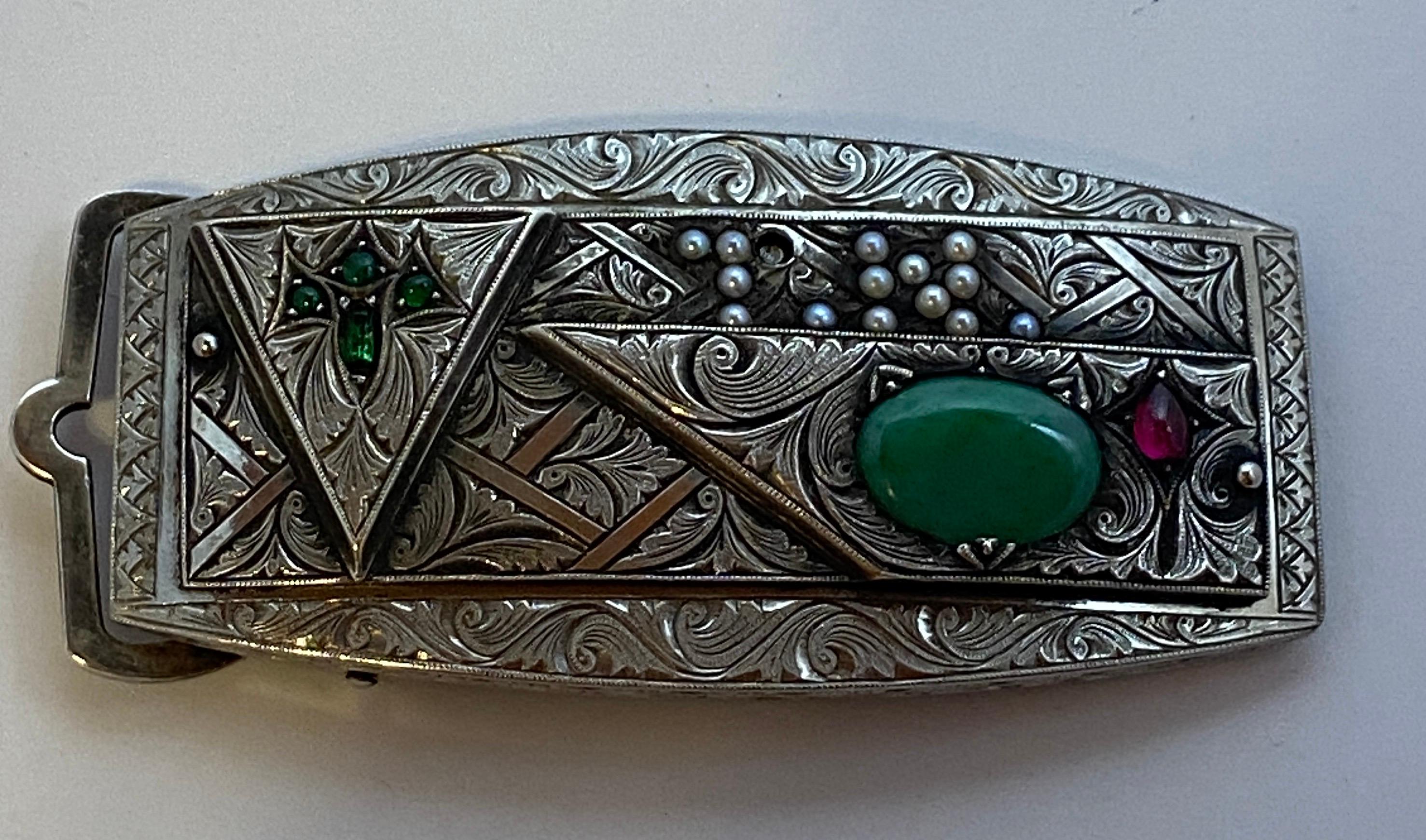 Custom, One-of-a-kind, Magnificently detailed Victorian Silver Belt buckle finely etched with swirls of leaves and gently waves, accented with an oval jade, four emeralds, ruby and 14 micro pearls (one micro pearl is missing). All stones and pearls