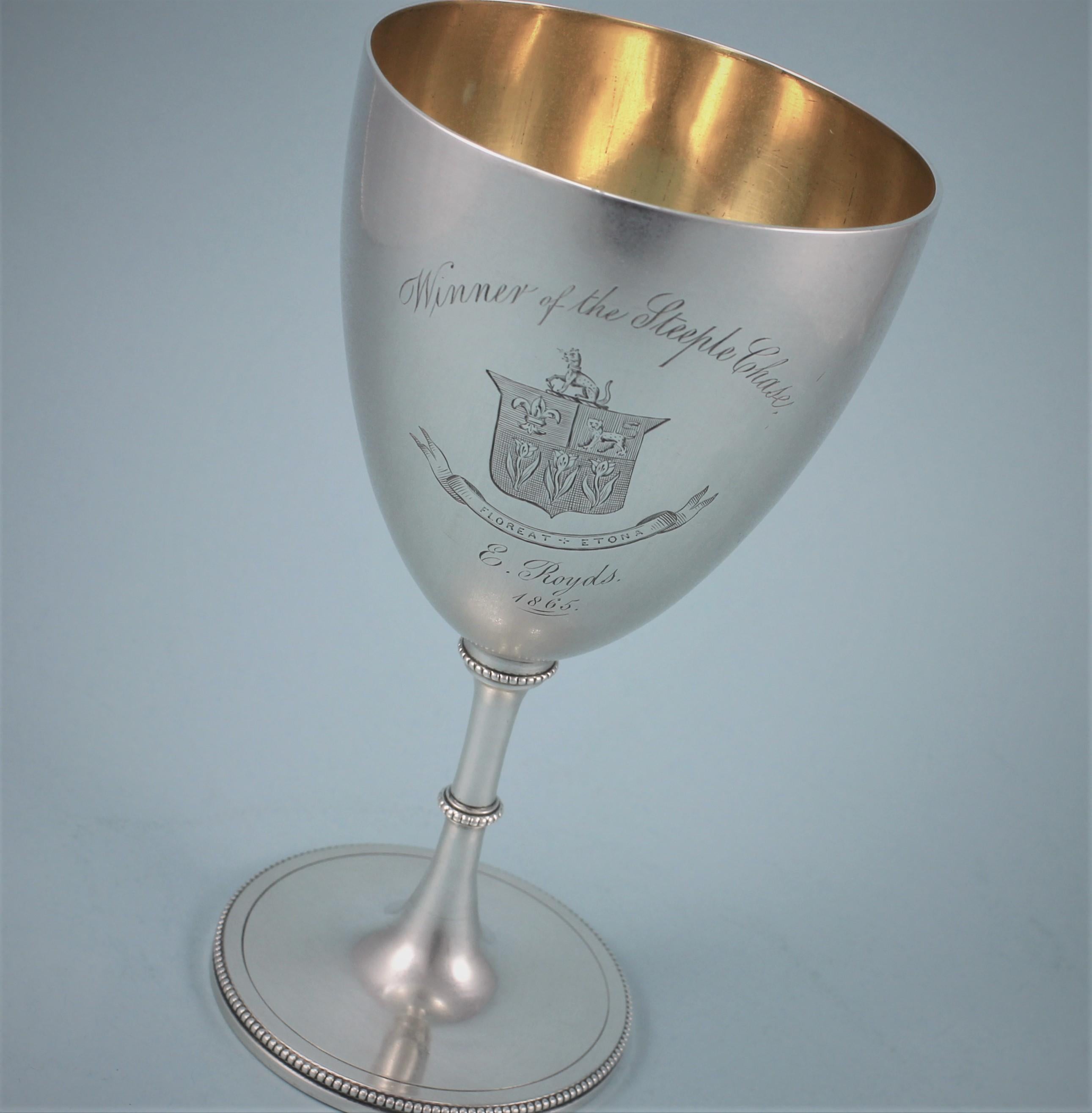 Elegant Victorian Eton College sterling silver goblet, silver gilt inside the bowl.
Maker: Daniel and Charles Houle. London 1864.
This goblet is one of a pair and is being sold individually.
The goblet is perfectly plain apart from the engraving