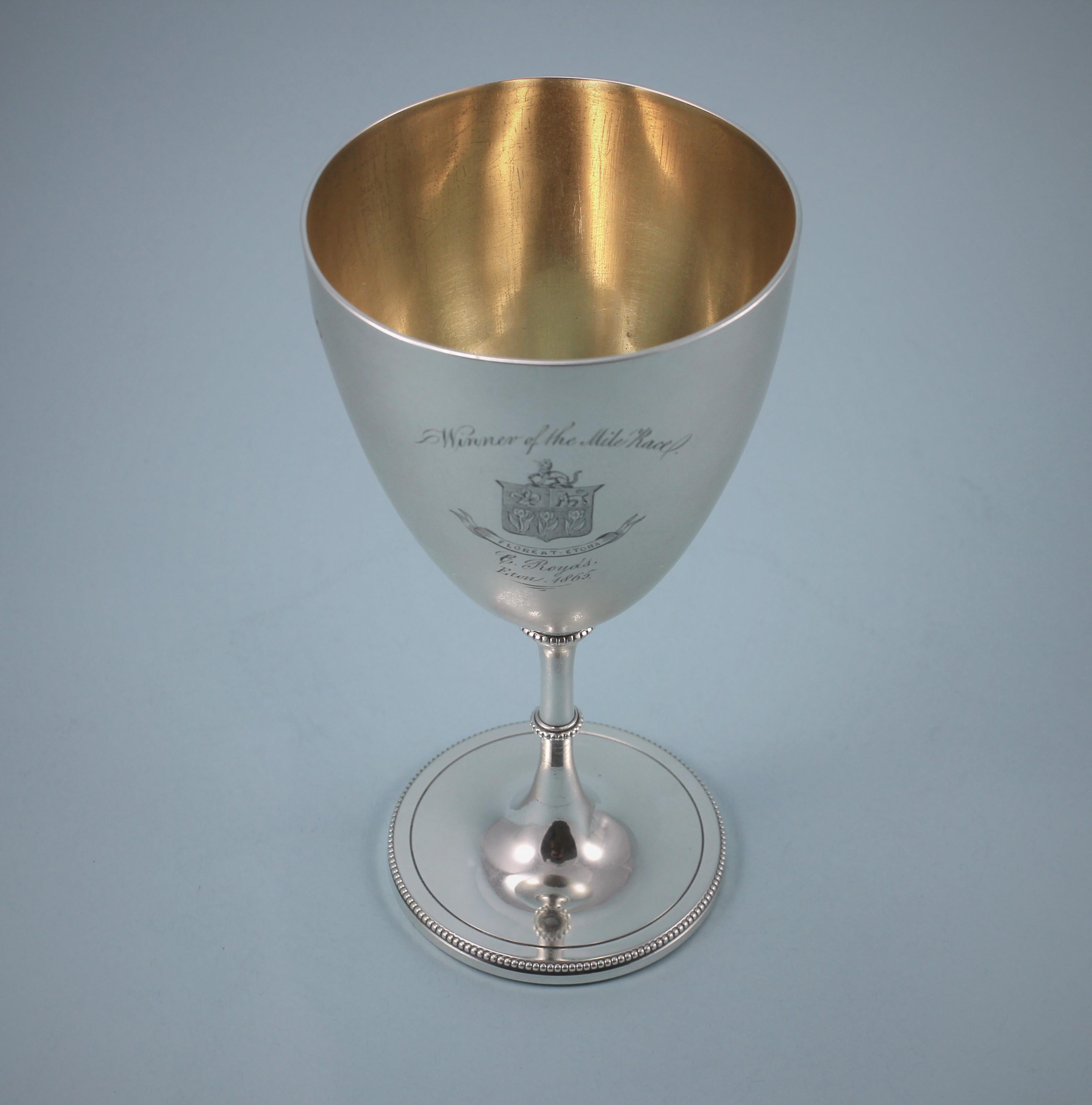 Elegant Victorian Eton College sterling silver goblet, silver gilt inside the bowl.
Maker: Daniel and Charles Houle. London 1864.
This goblet is one of a pair and is being sold individually.
The goblet is perfectly plain apart from the engraving