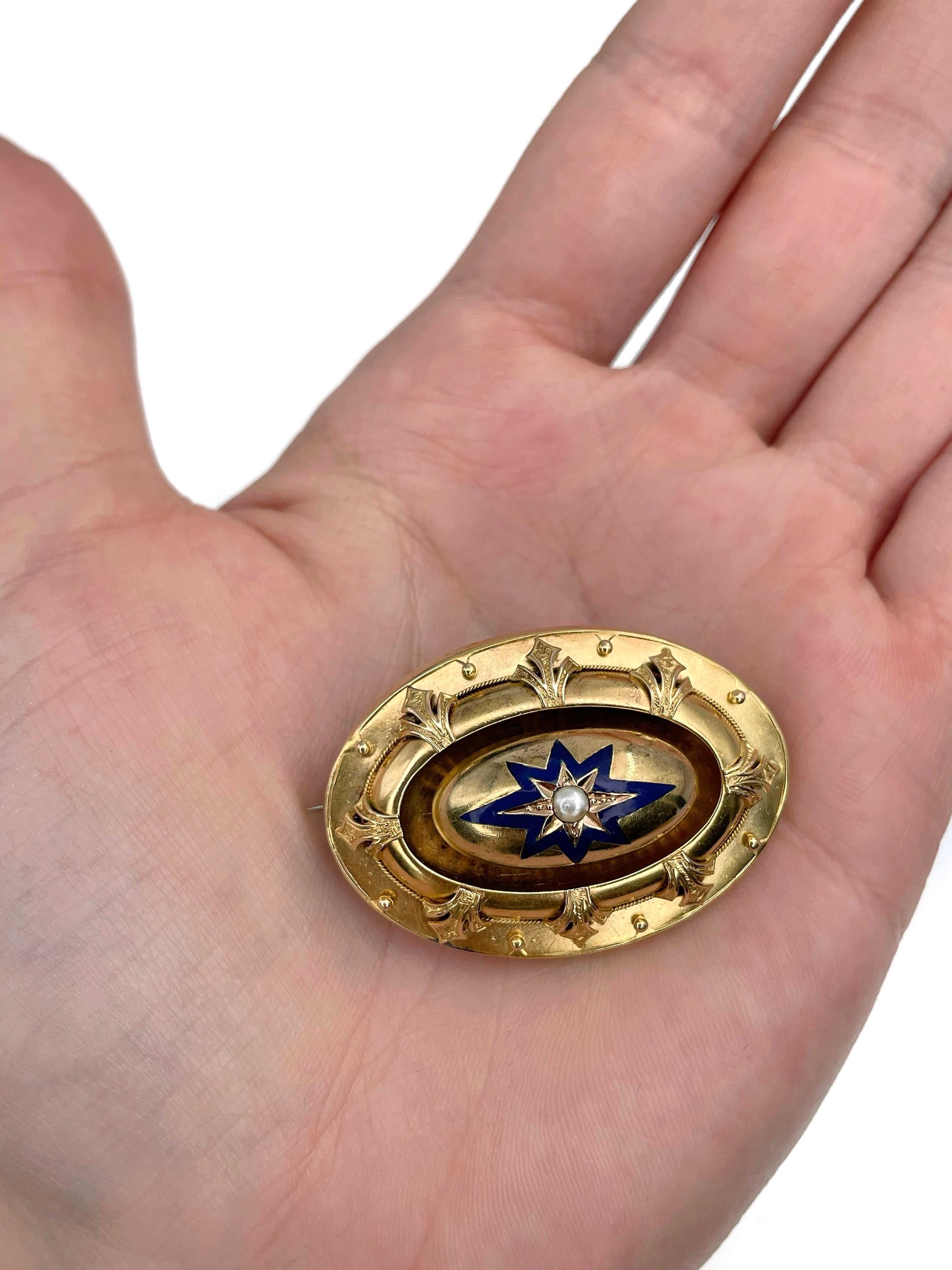 This is a Victorian Etruscan Revival locket pin brooch crafted in 15K yellow gold. 

The piece has an eight pointed royal blue enamel work star. Bead set in the center is a round natural pearl. 

On the back there is a space with a removable framed