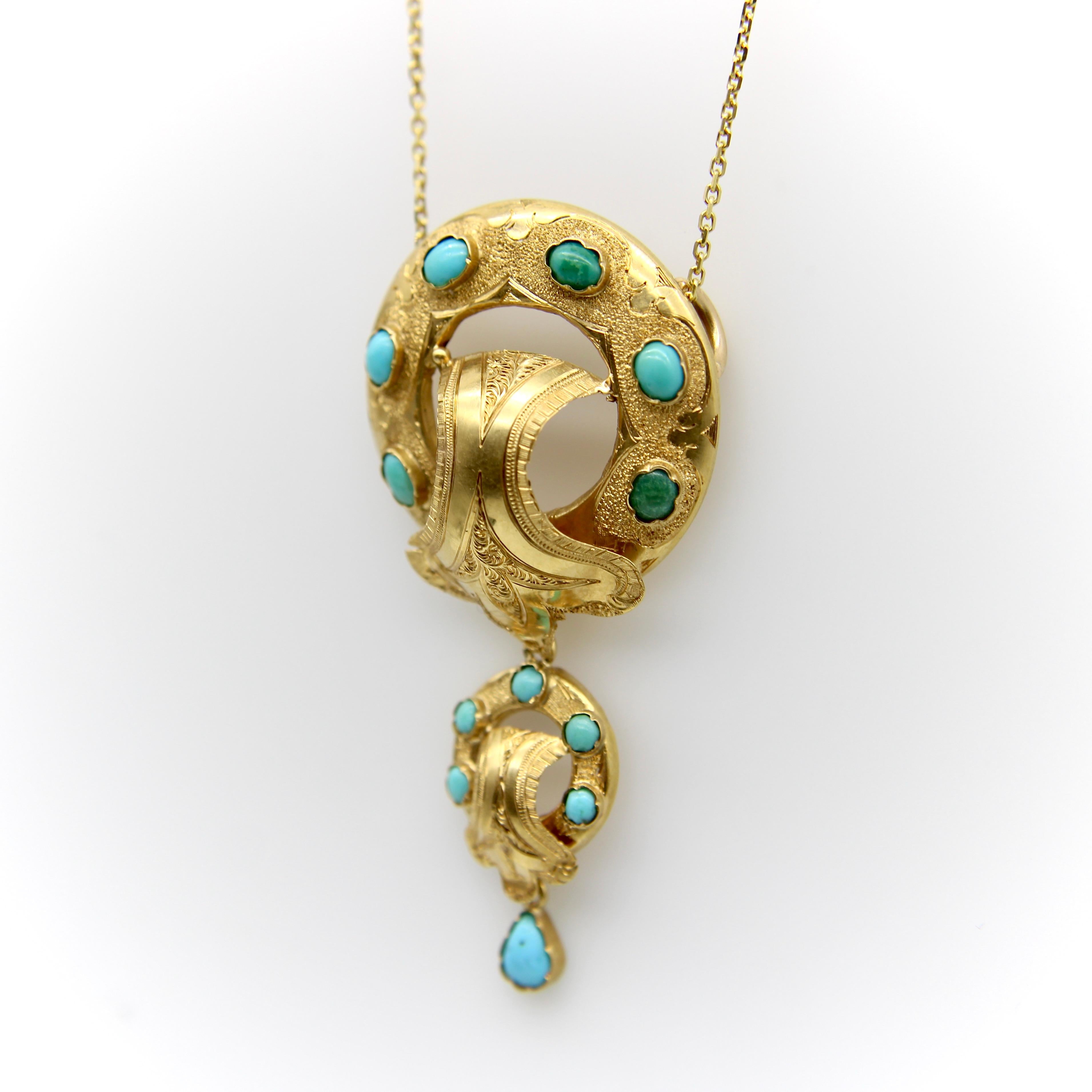 This is a fantastic 14 karat gold and turquoise Etruscan Revival pendant necklace from the Victorian era. It features detailed hand engraved gold and fabulous turquoise cabochons with movement from dangling elements.

Etruscan Revival jewelry has a