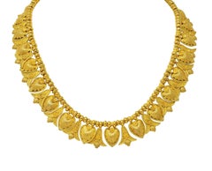 Collana vittoriana Etruscan Revival in oro 18 carati con frange di palme e loto