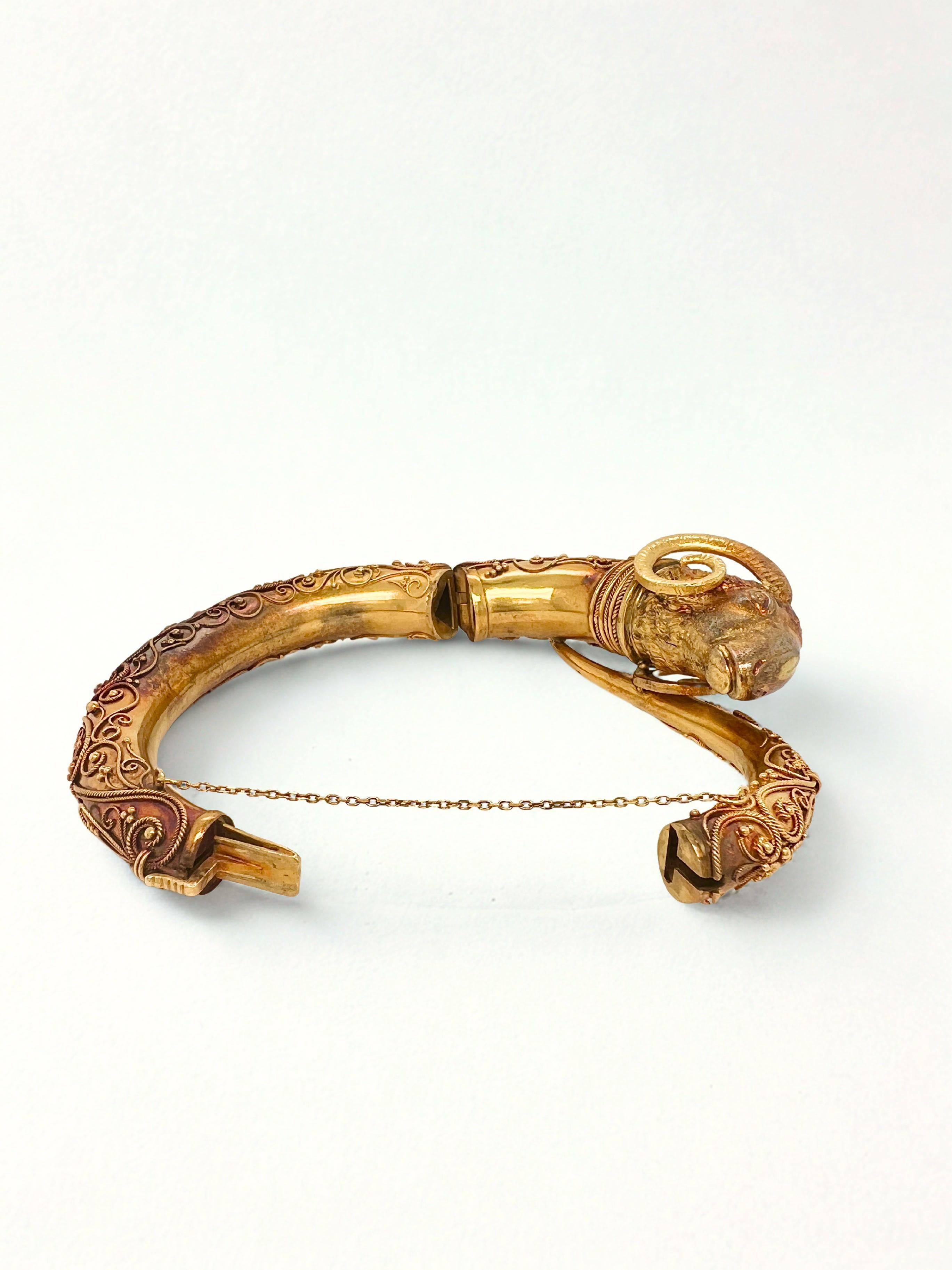 Victorian Etruscan Revival 18k Gold Rams Head Bangle Bracelet

Featuring a wire and granulated decoration on a rams head form bangle bracelet. 
Inner measurement is 6
