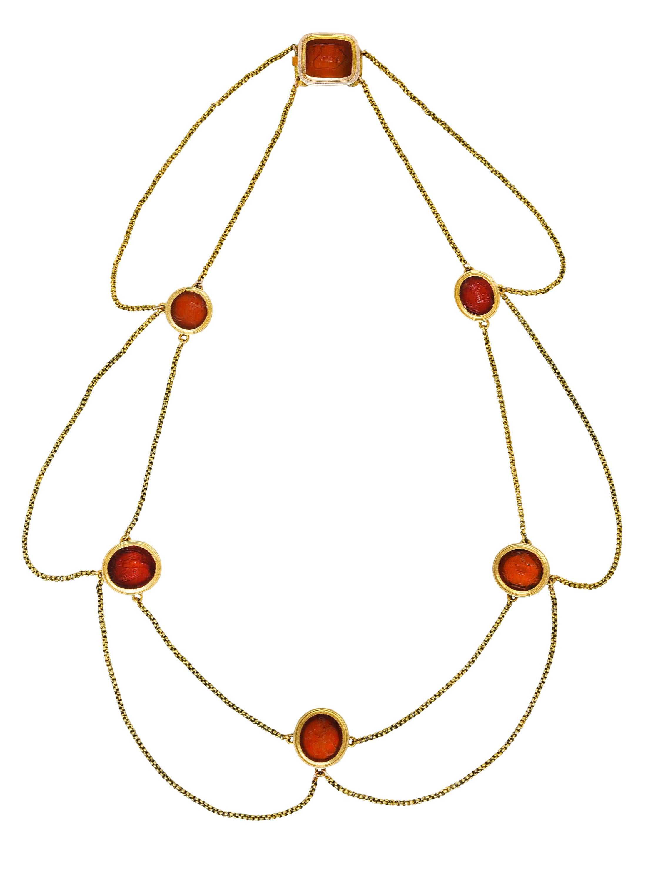Necklace is designed as swagged rolo chain with six carved intaglio carnelian stations

Translucent reddish orange in color with medium saturation - ranging in size and shape

Depicting a siren, eagle, horse, leaping goat, ram, and wooly goat

Bezel