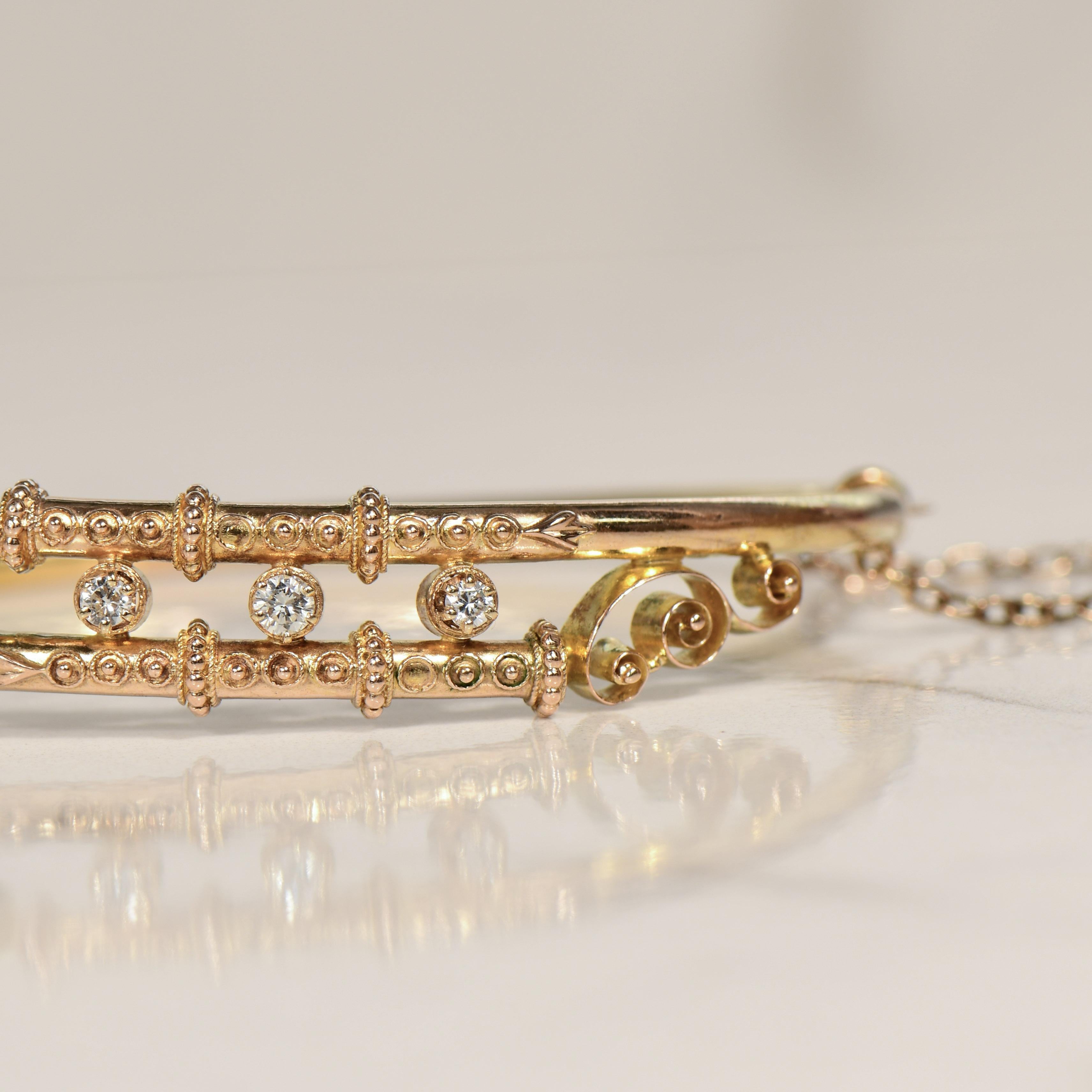 Behold a magnificent piece of history with this 14K antique diamond bangle, a testament to the Etruscan Revival style, boasting a diamond bypass hinged design. This bracelet transports you back in time to an era when craftsmanship was paramount and
