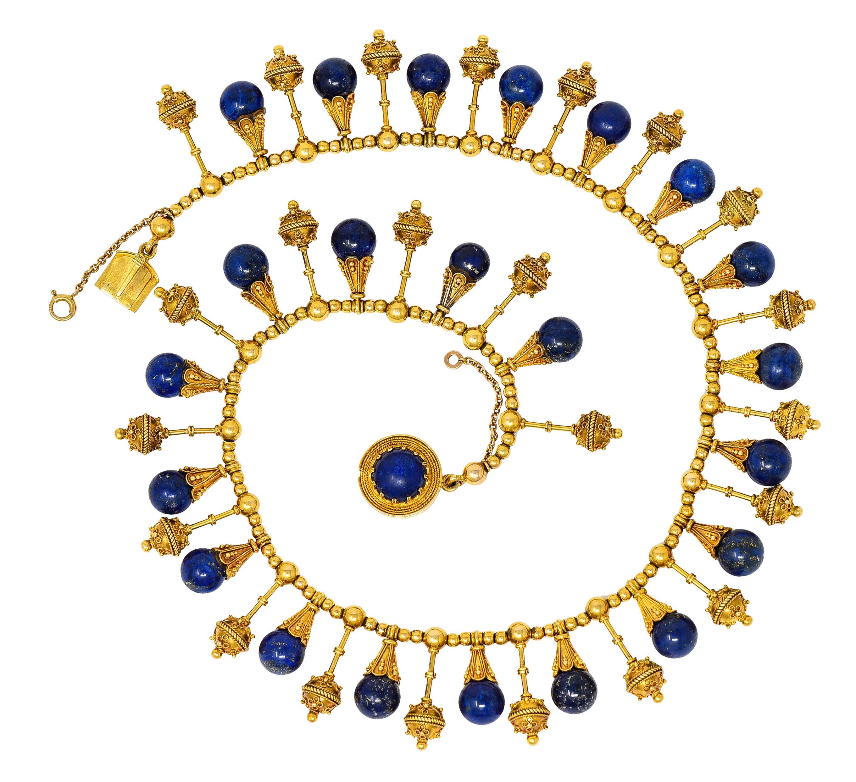 Fringe style necklace is comprised of strung polished gold beads suspending undulating drops

Elongated amphora drops alternate with 8.5 mm lapis lazuli drops

Well matched and mottled ultramarine blue with pyrite flecks and excellent