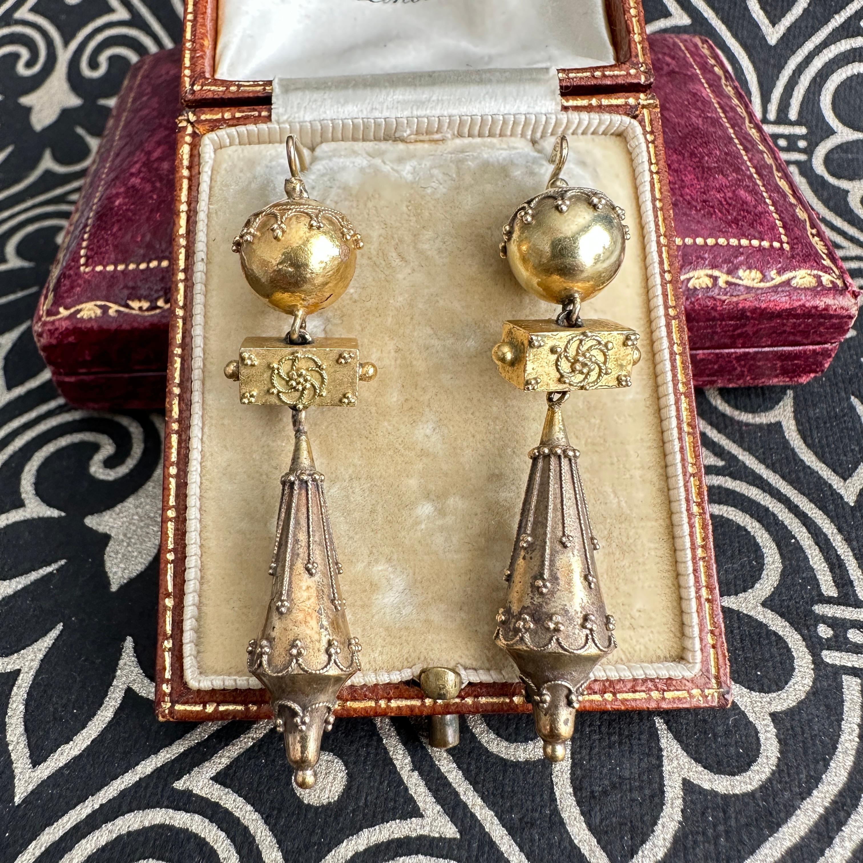 Details:
Not perfect, but Gorgeous pair of Etruscan Victorian 14K and 18K yellow gold earrings. These date to between 1860-1880. The earrings are sweetly decorated with delicate little scallop filigree and dots, and are absolutely magnificent. They