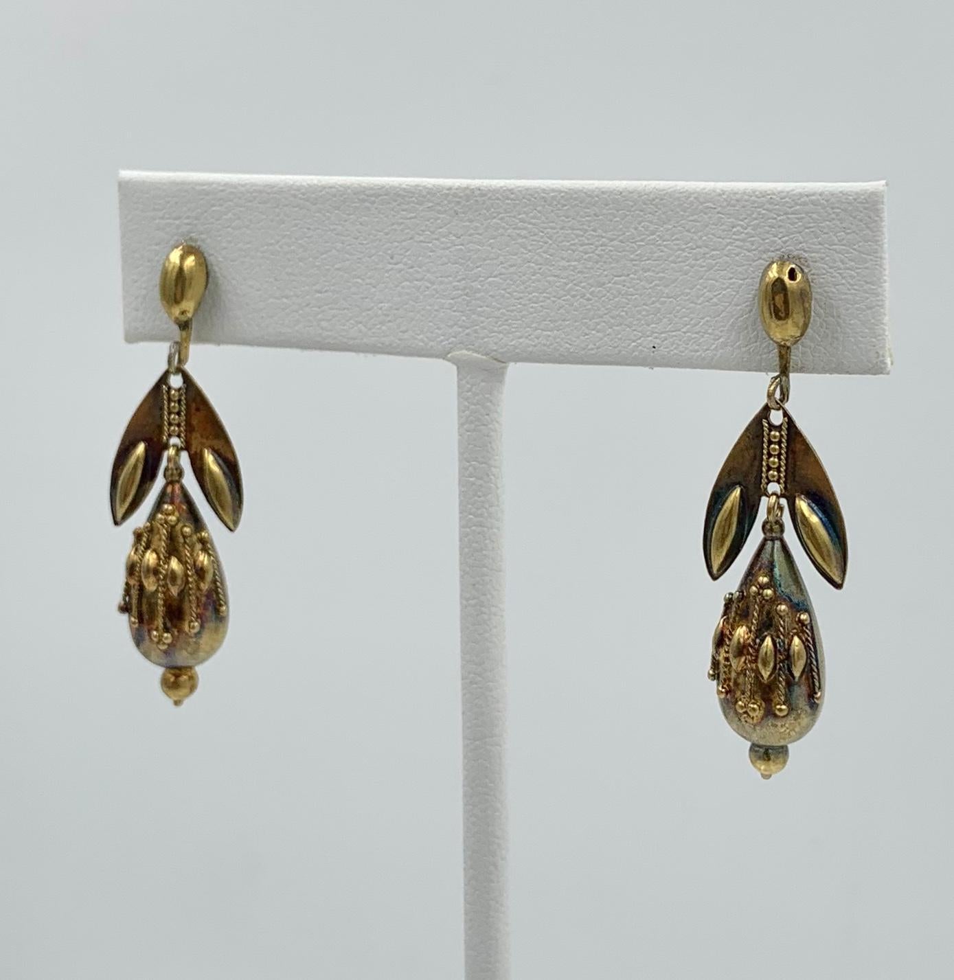 A spectacular pair of early Antique Etruscan Revival Victorian Torpedo Pendant Dangle Drop Earrings in 14 - 16 Karat Rose Gold.   These earrings are of the highest quality.  They have extraordinary Etruscan beaded granulation - the hand applied tiny