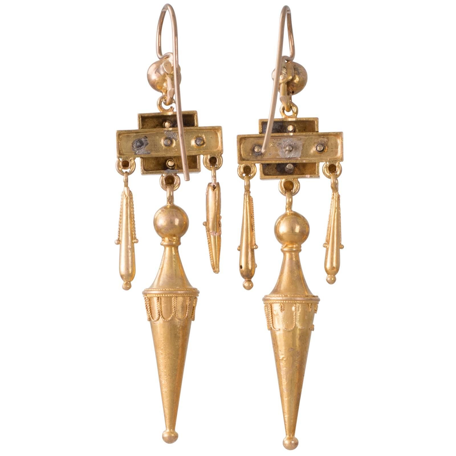 A pair of 14ct yellow gold Victorian drop earrings each with a long pointed drop to the centre with a shorter pendulum to either side from a decorative box style top all sections decorated with fine bead and wirework from shepherd's hooks (added