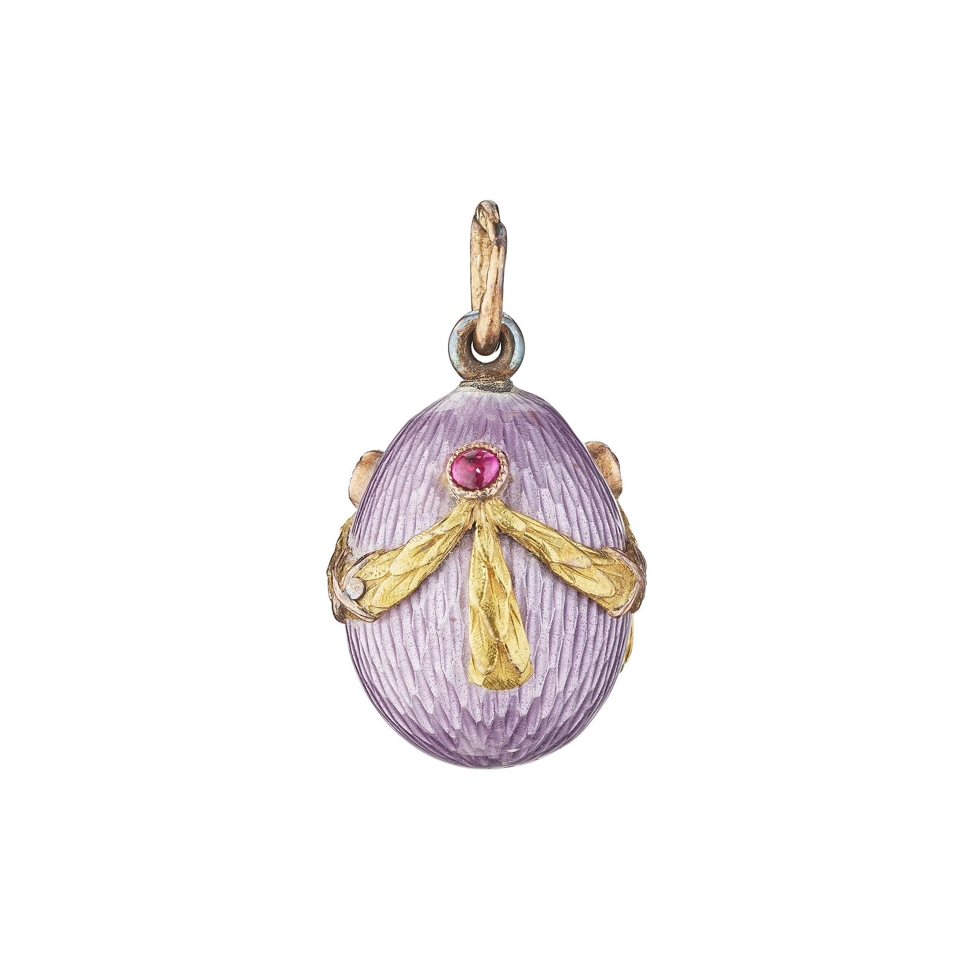 Wear a piece of history around your neck with this luscious Victorian Faberge ruby, 14 karat yellow gold, silver, and guilloche enamel egg pendant jewel.  St. Petersburg, Russia.  Circa 1900.   Originally purchased from Wartiski Ltd, 138 Regent