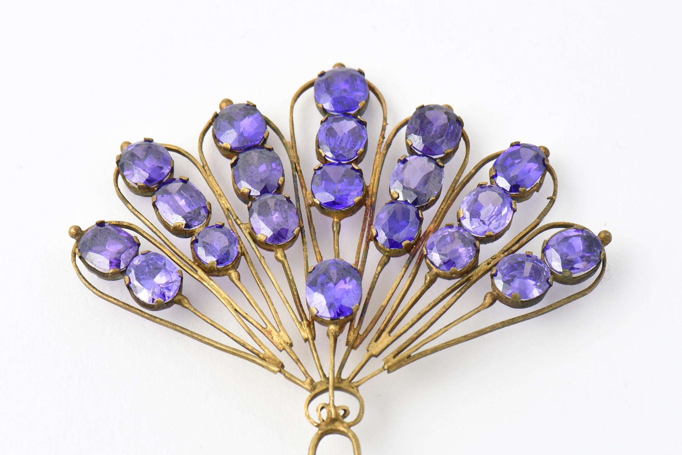 Victorian gilt silver hair comb/hairpin with peacock motif starring purple colored stones.
