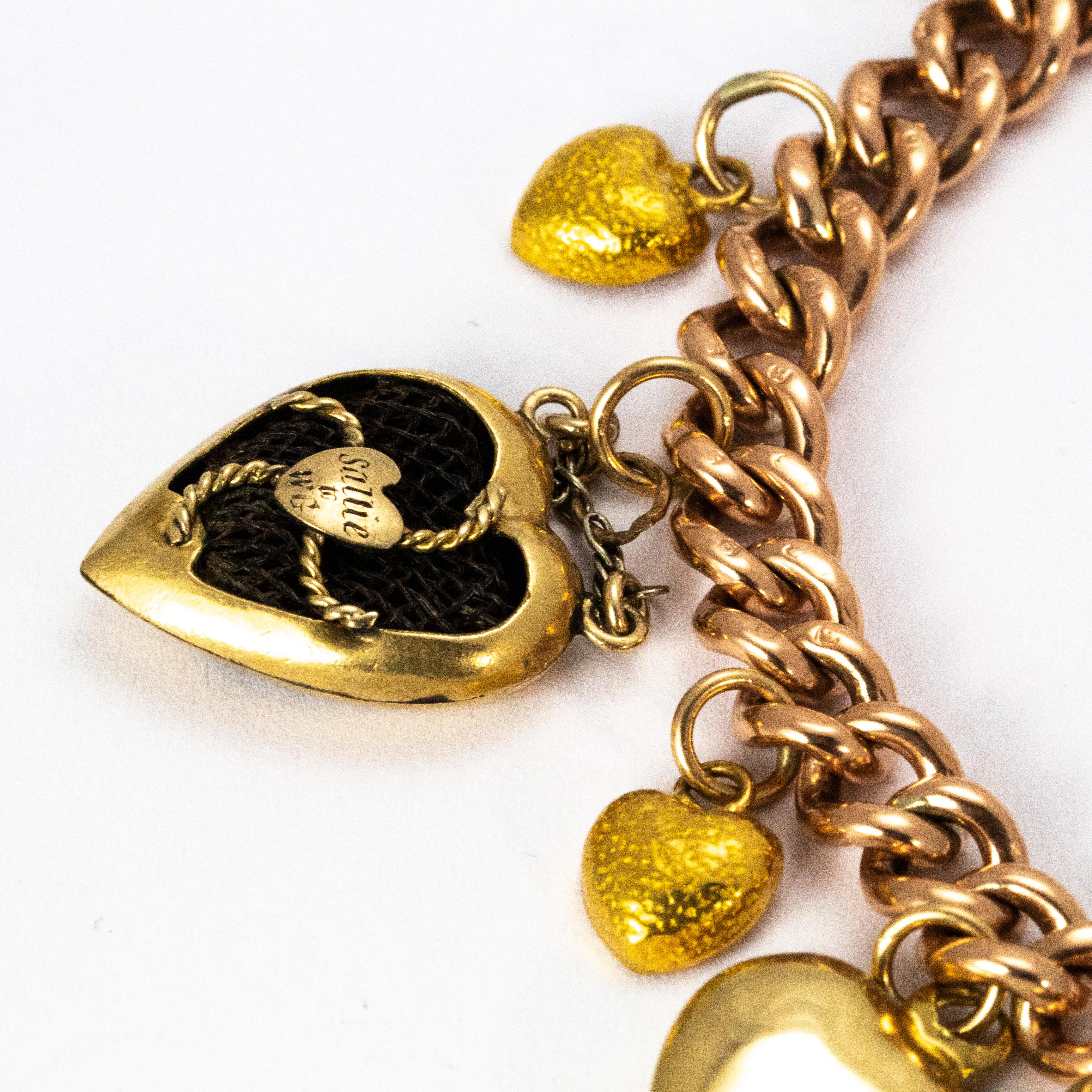 A charming charm bracelet form the Victorian era comprised of a 9 karat yellow gold chain and fifteen heart charms. The four largest hearts are particularly special; one functions as a locket, another is set with stars , and one is styled as a