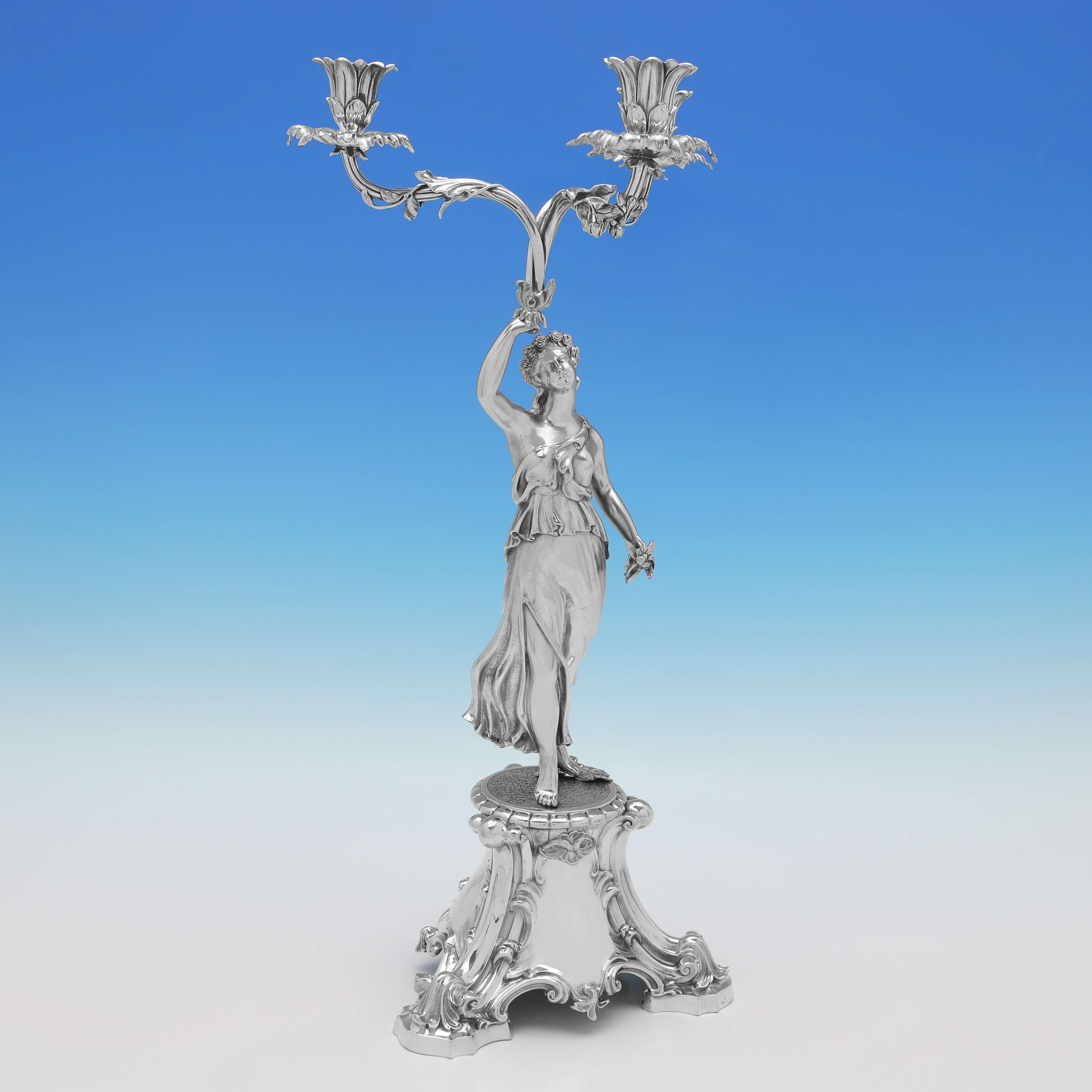 Hallmarked in London in 1859 by Edward & John Barnard, this incredible pair of Victorian, Antique Sterling Silver Candelabra, are beautifully modelled, each holding 3 candles, and with a female and male figure holding the lights overhead. 

Each