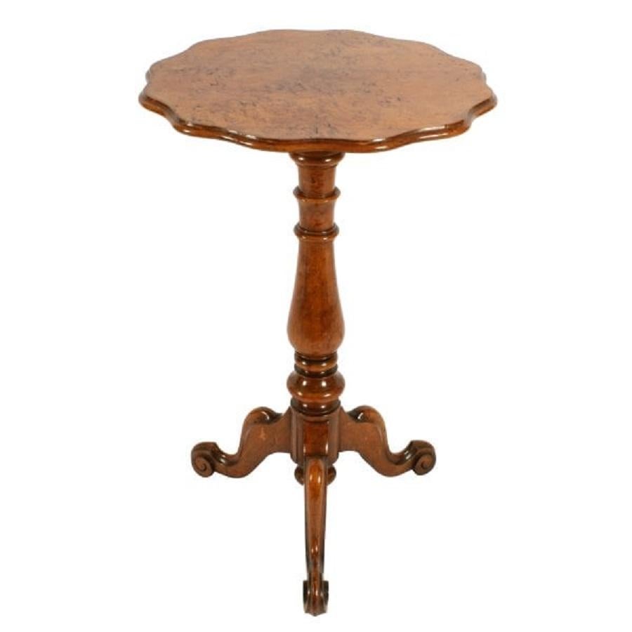 A 19th century Victorian figured oak tripod table.

The table has a circular top with a shaped and moulded edge.

The base has three cabriole legs with scroll carved toes and a baluster shaped stem.

The table is made from very good quality