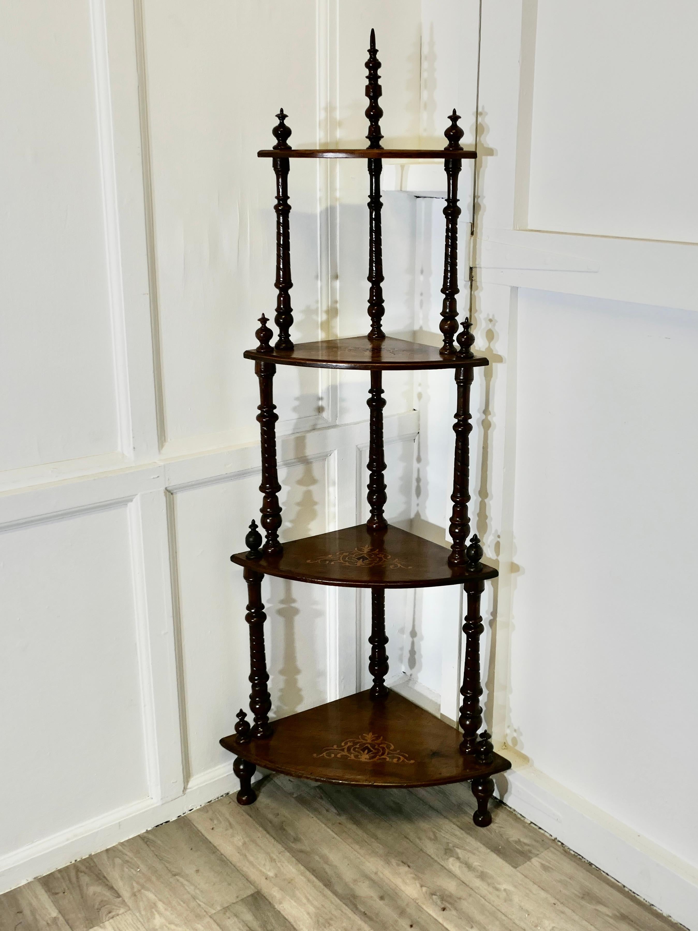 Victorian Figured Walnut Corner Whatnot, Etagere

Once a much prized piece this attractive etagere has four tiers in figured walnut with very attractive turned upright supports.
The Whatnot is in good antique condition its is 59” tall, 23” across at
