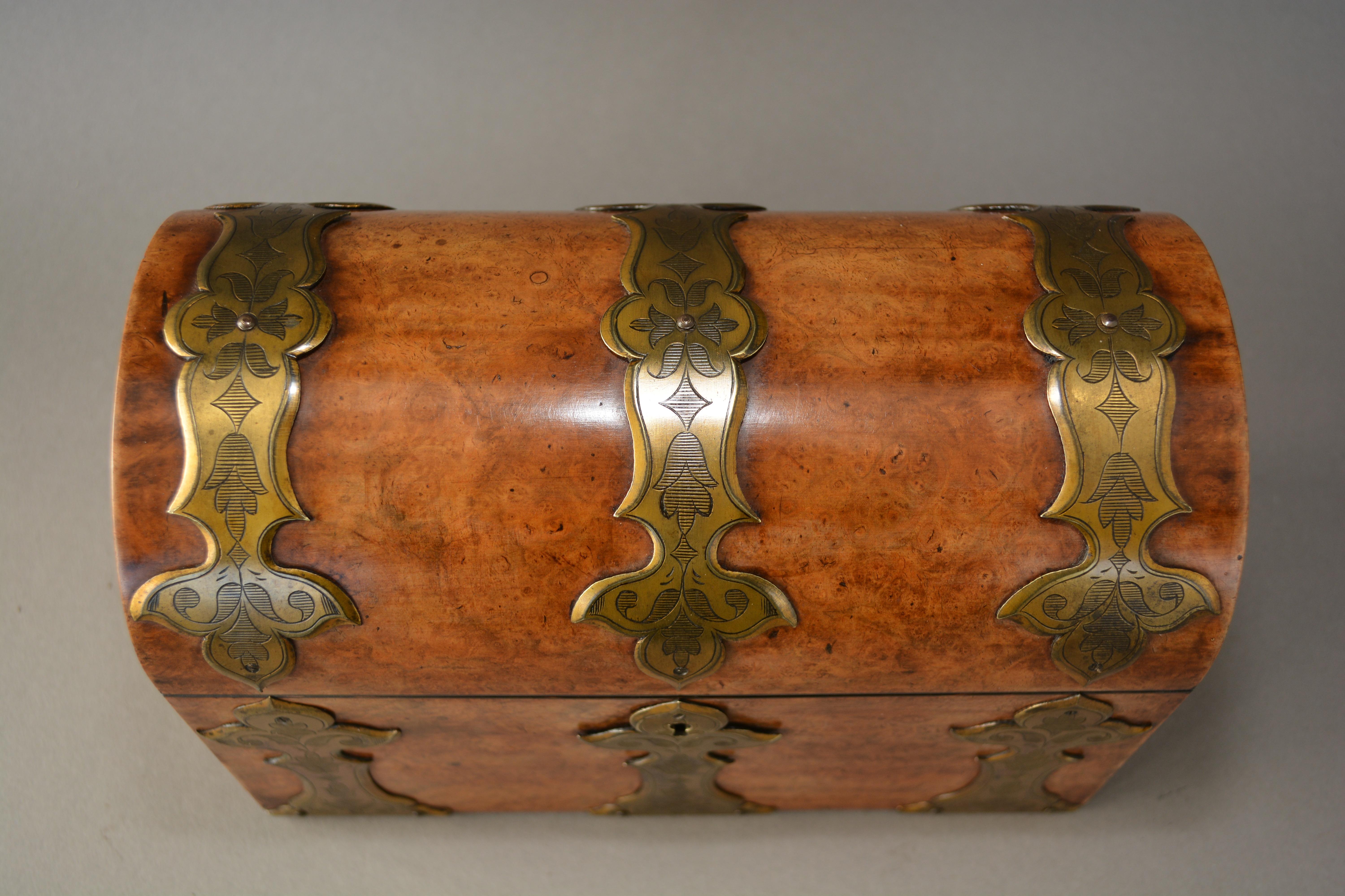Superb quality Victorian dome topped stationary box in the Gothic revival taste. Hand made from figured walnut with brass strapping and compartmented interior. With super colour and patination. English and dating from circa 1870.