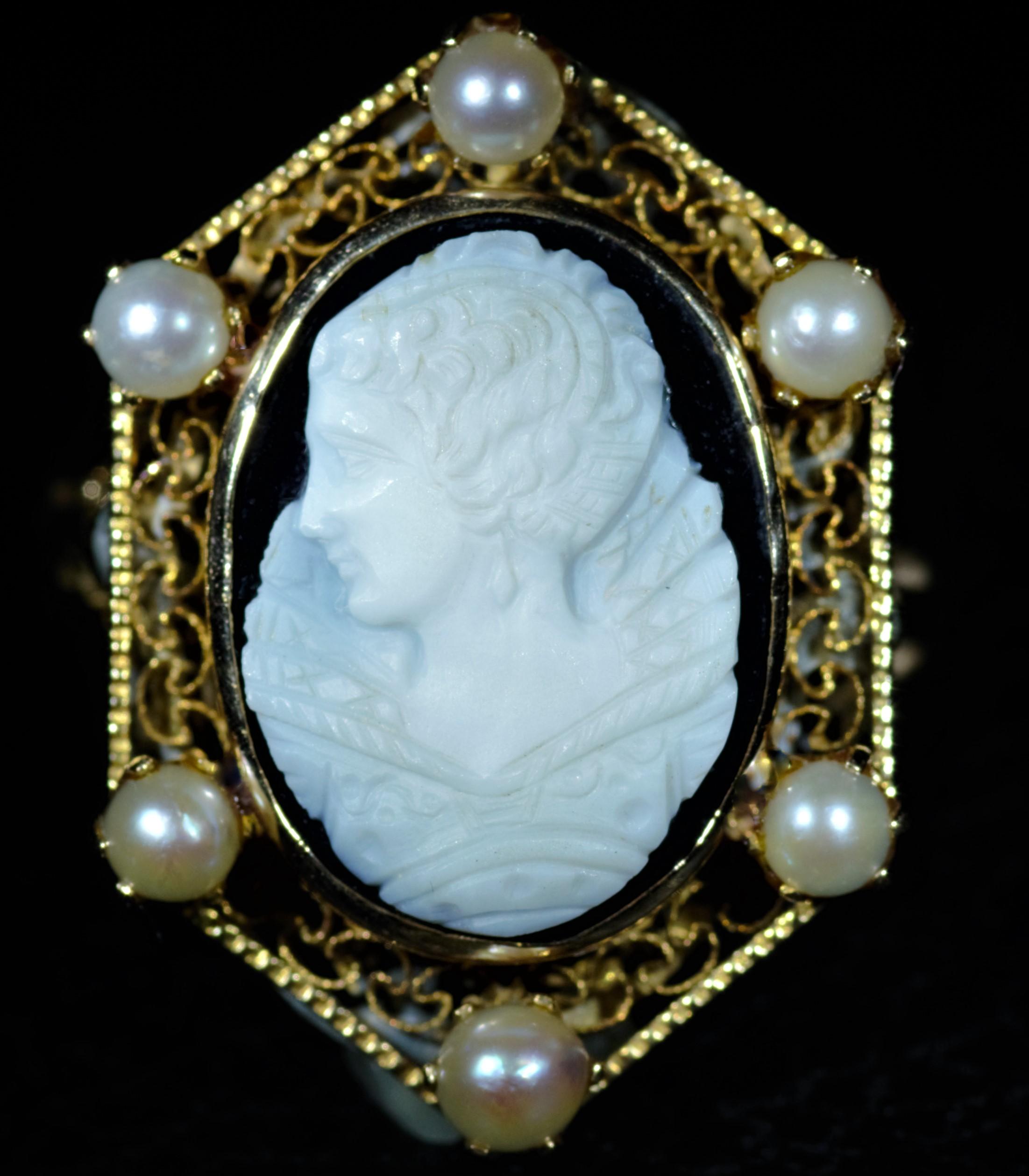 Victorian Filigree Cameo Ring finished with six Pearls surrounding the center hand carved cameo in 14 karat yellow gold.  