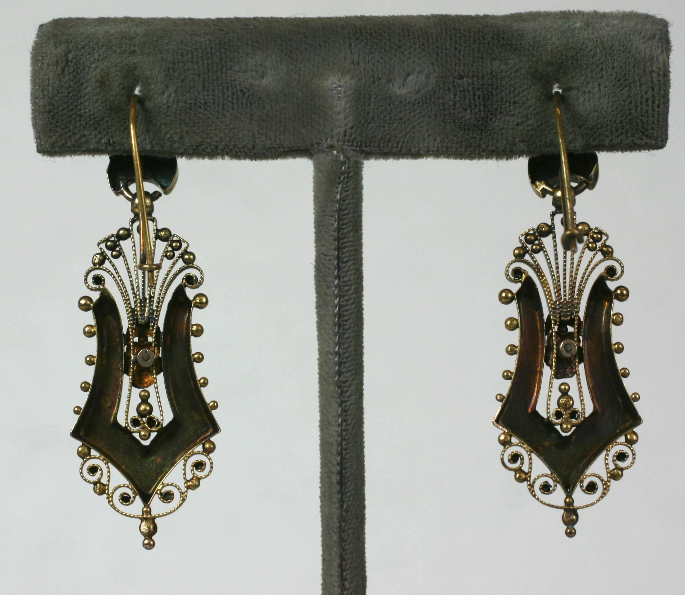 Elaborate filigreed Victorian 14k gold earrings from the late 19th Century. Rose gold applications in harp form are framed by etruscan bead work and florets. Yellow gold has been left with original patina. Can be polished to high finish if