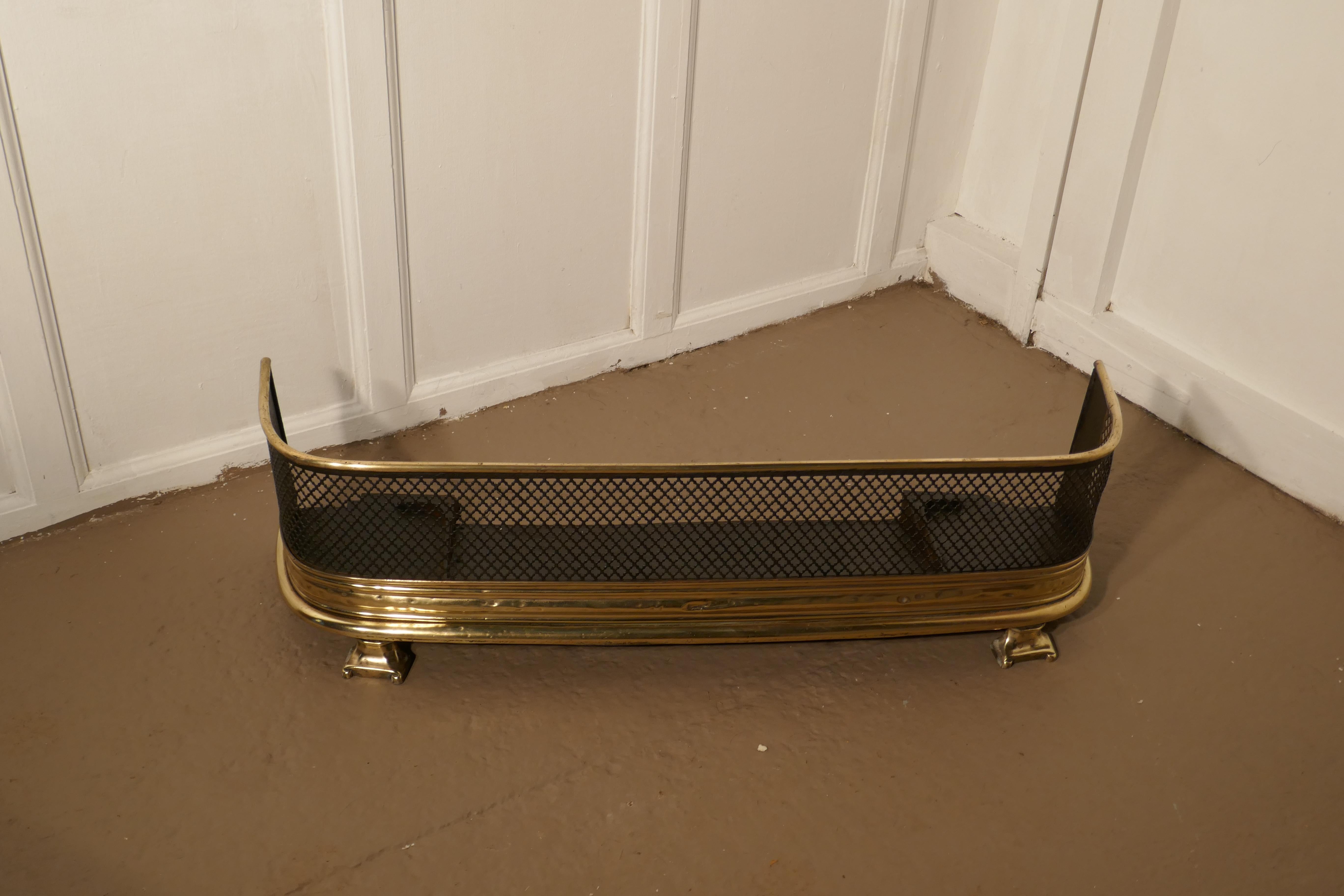 Victorian fireside fender

A Victorian antique fender often known as a nursery guard as it completely surrounds the fire 
The fender has a slightly curved brass top rail, steel metal mesh and a deep brass base with claw feet

The fender is in