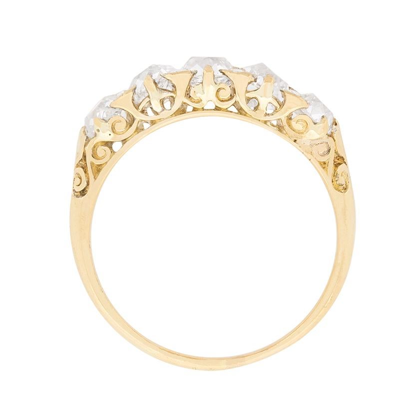 A stunning five stone ring, all hand crafted from 18 carat yellow gold. The diamonds are sparkling old cuts with a combined weight of 1.90 carat. The centre diamond weighs 0.50 carat and they graduate in size moving out, two 0.40 carat stones and