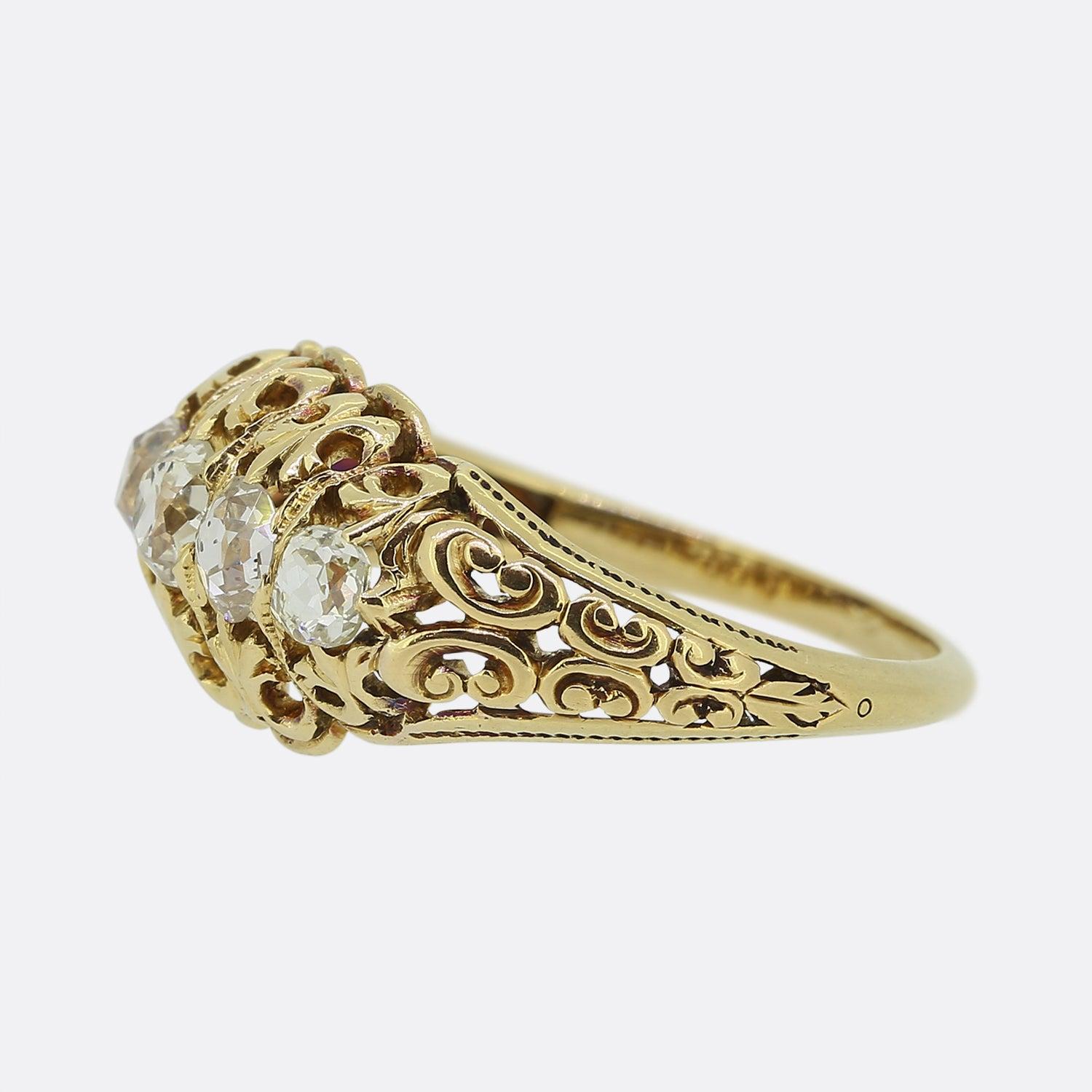This is a wonderful 18ct yellow gold late Victorian ring. The ring features five graduated old cut diamonds with the largest of which in the centre. The ring has been expertly crafted with pierced Fleur De Lis detail and we have never had the
