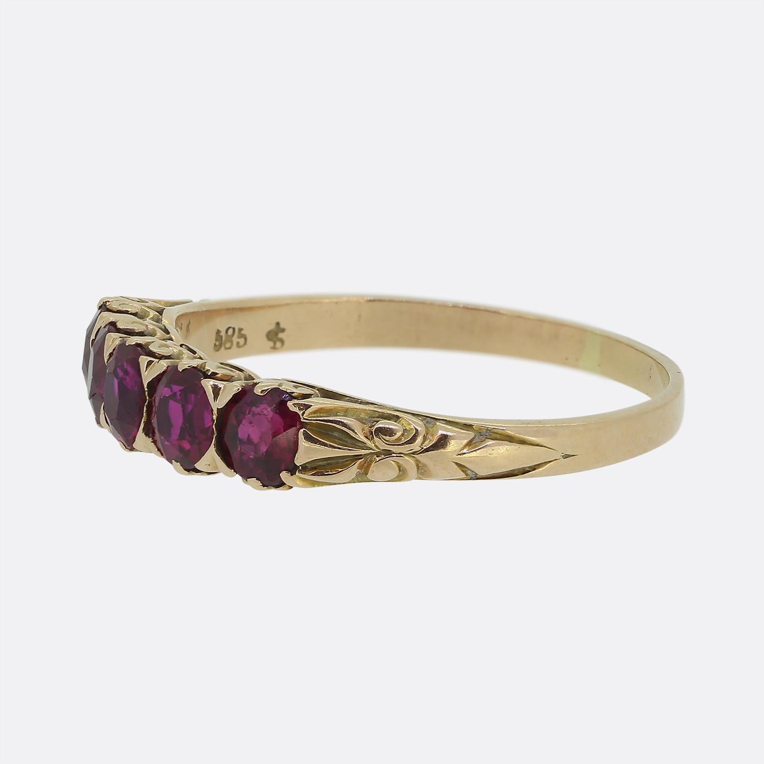 Here we have a refined and elegant five-stone ring taken from the Victorian period. Crafted from a rosey 14ct yellow gold, this antique piece showcases a stunning row of vibrant pinky red round faceted rubies. Each stone has been individually claw