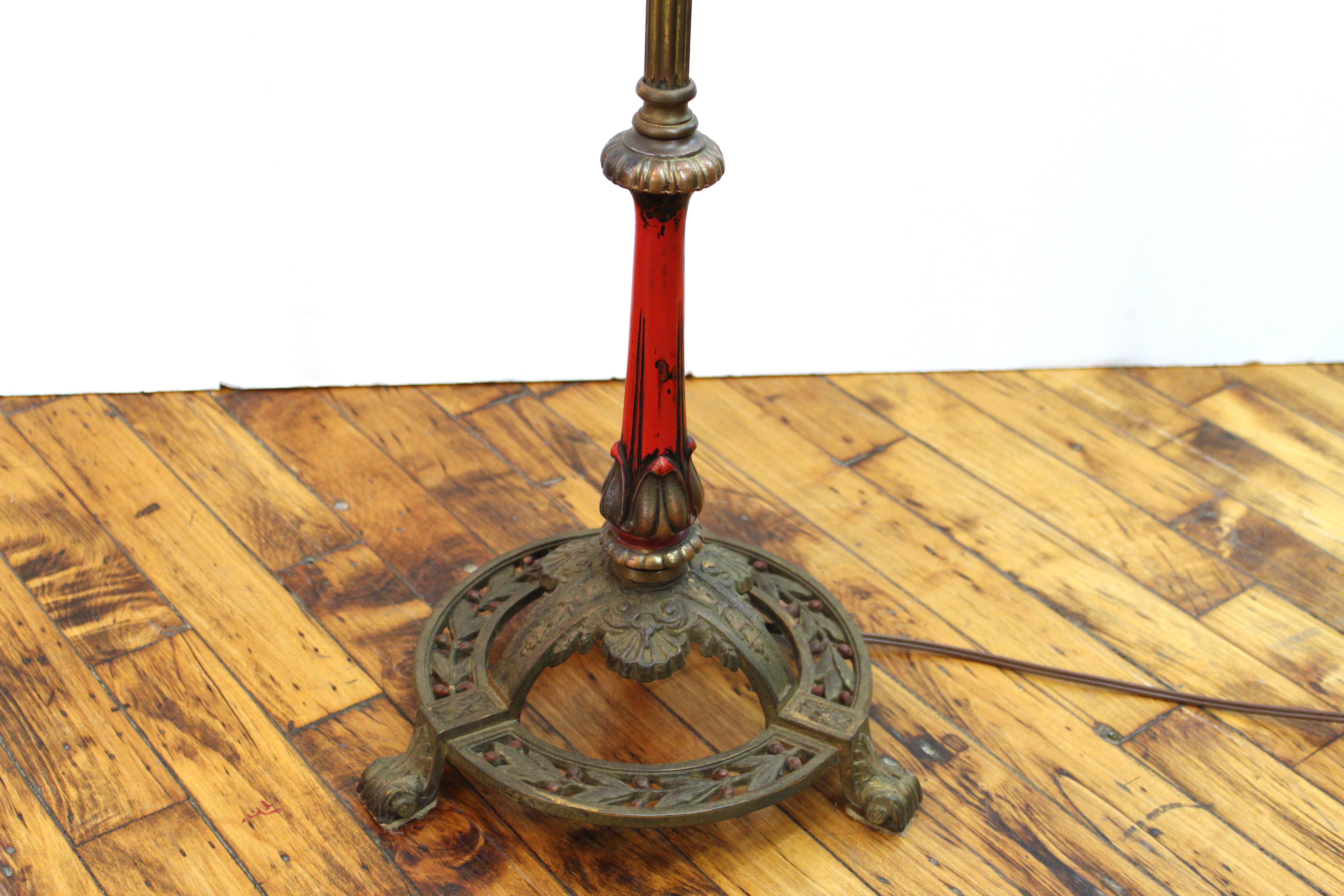 Victorian floor lamp in the style of Caldwell, with brass fluted shaft and intricate leaf design on the round base, partially painted on the base stem. Made in the United States in the 1890s, in great antique condition.