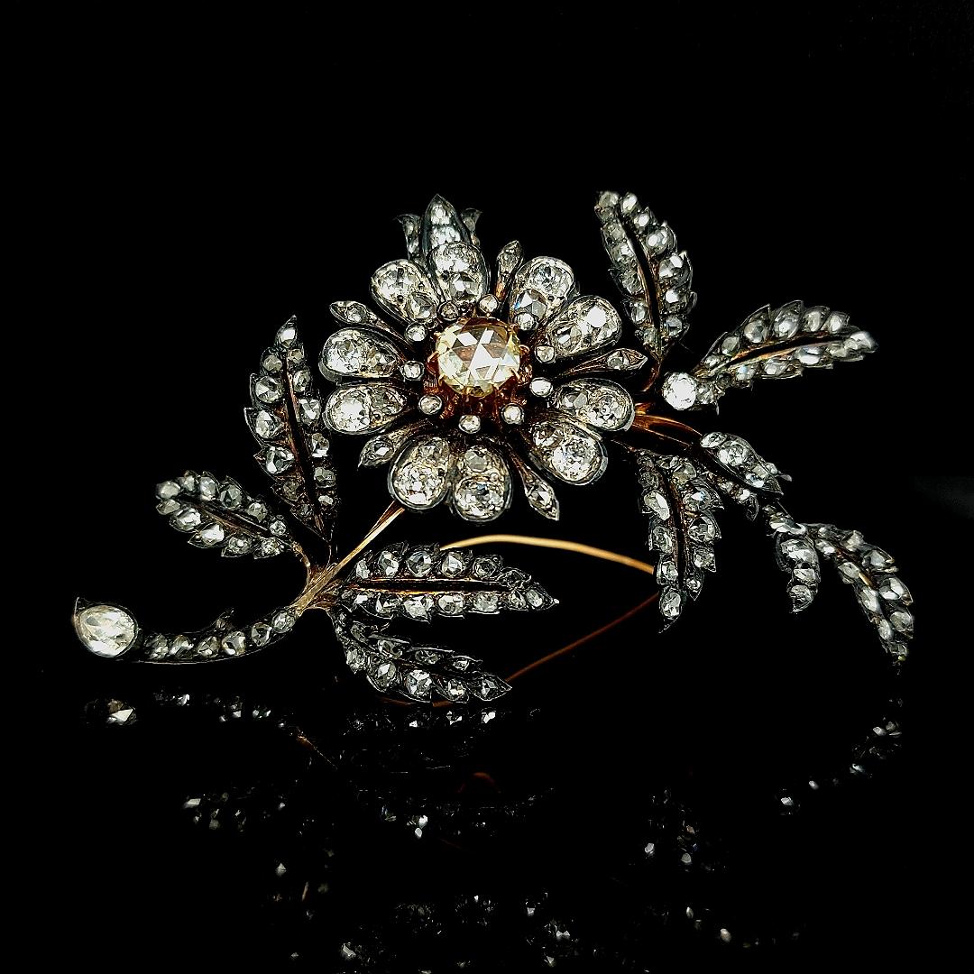 A magnificent and stunning, large antique Victorian 9.3 carat diamond and 18kt pink gold, silver set floral brooch.

Victorian Floral Brooch in Silver, Pink Gold, 9.3 Carat Old European & Rose Cut Diamonds.
.
Diamonds: 132 old mine and rose cut