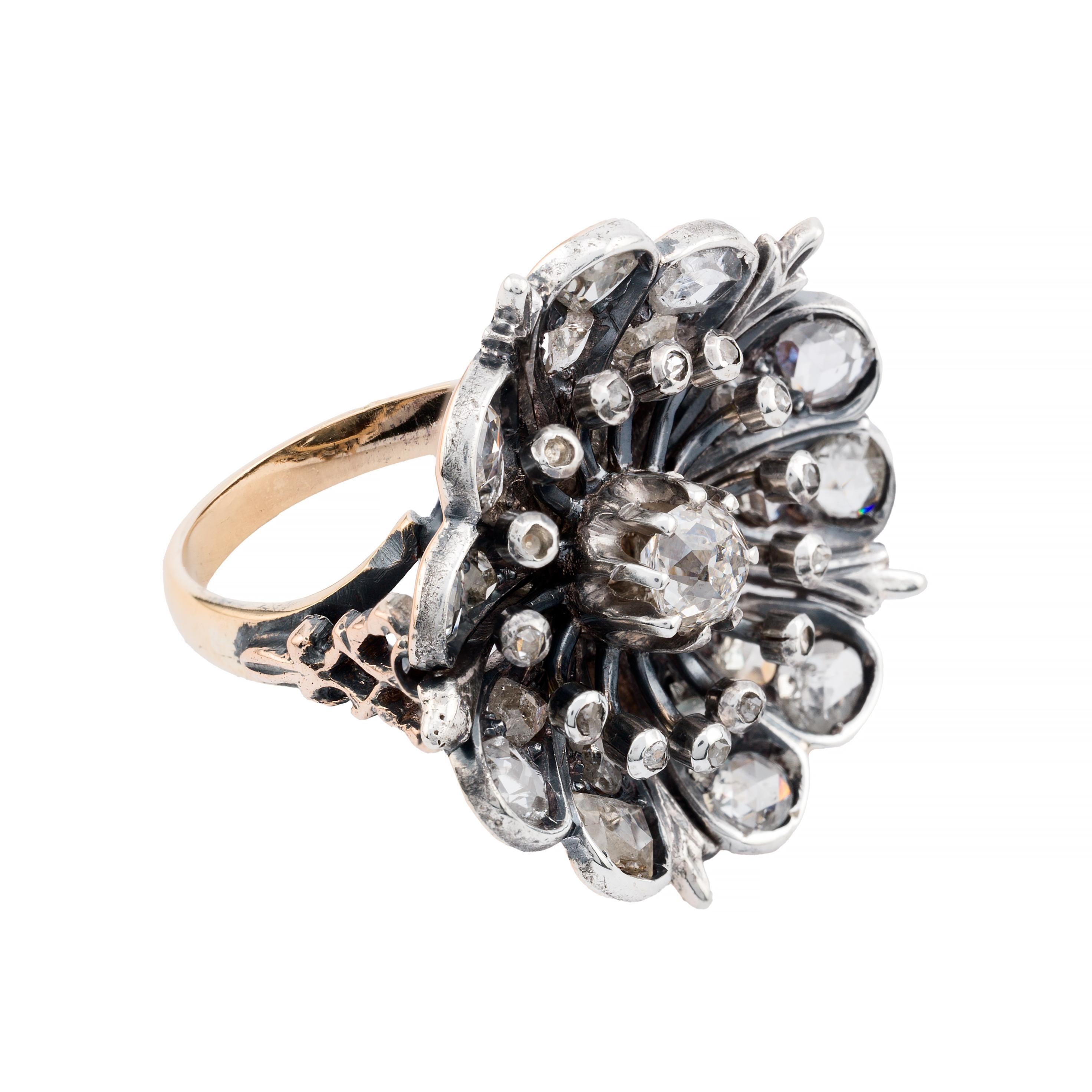 Aston Estate Jewelry Presents:

A striking victorian Flower form ring featuring a 0.50 carat old mine cut diamond, with a clarity of VS2 and an H color grade. The central diamond is surrounded by 2.20 carats of rose cut diamonds, with SI1 clarity