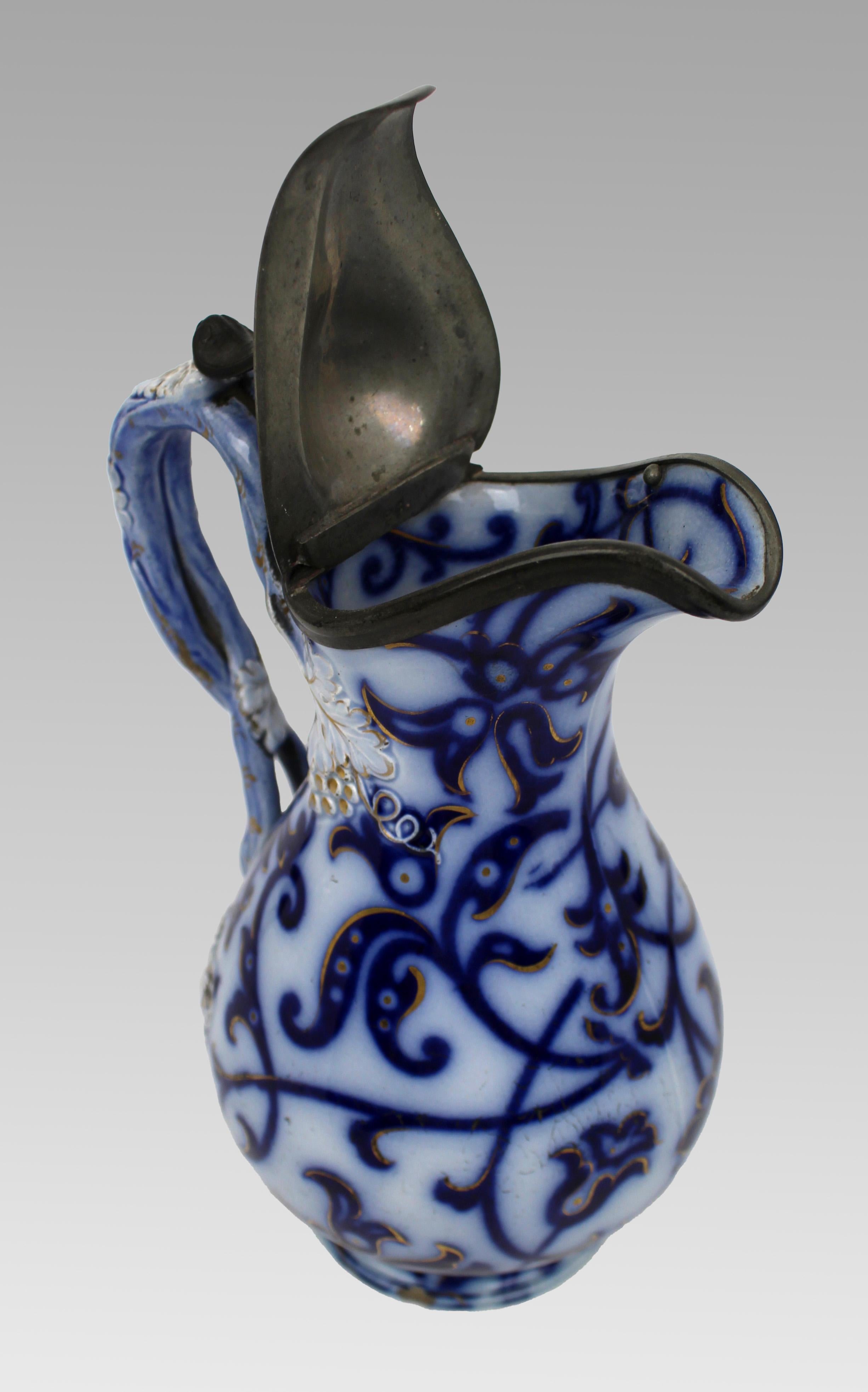 Earthenware Victorian Flow Blue and Gilded Ceramic Jug with Pewter Lid, England, circa 1850 For Sale